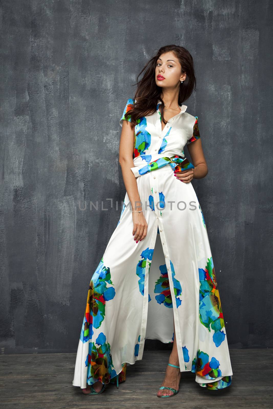 Glamour Portrait of young woman in white summer dress