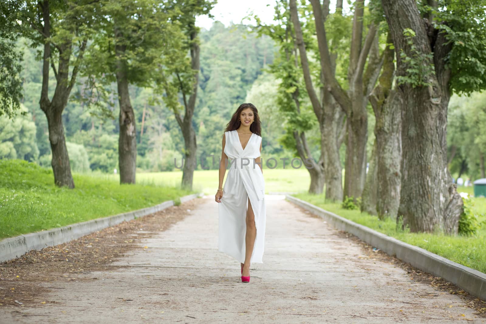 Portrait of young woman in white dress