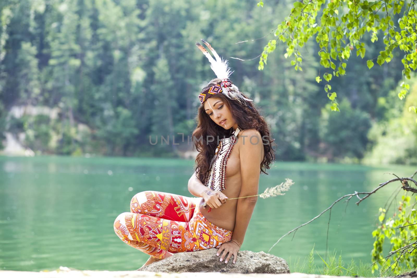 Young woman in costume of American Indian by andersonrise