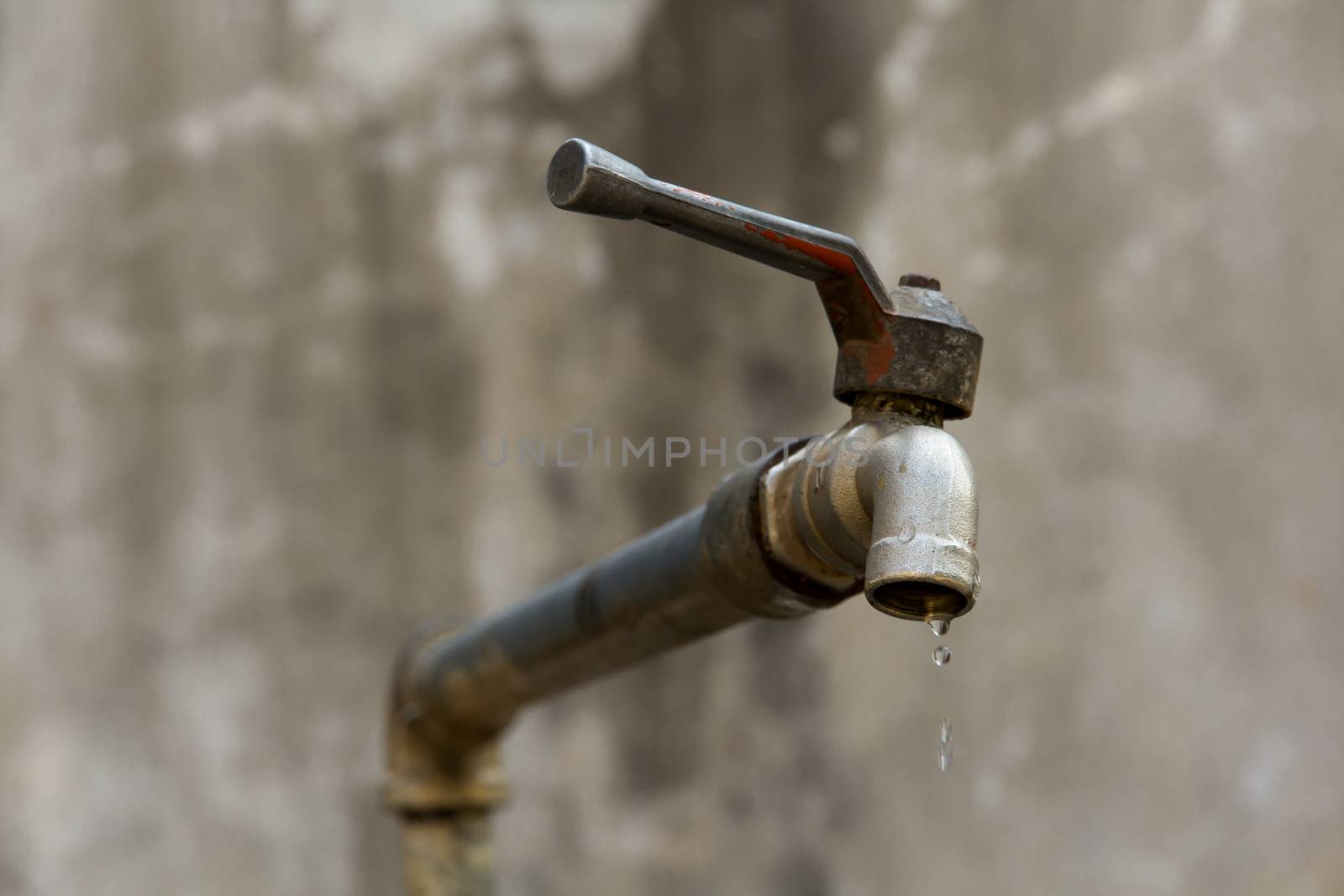 a dripping tap showing water being wasted