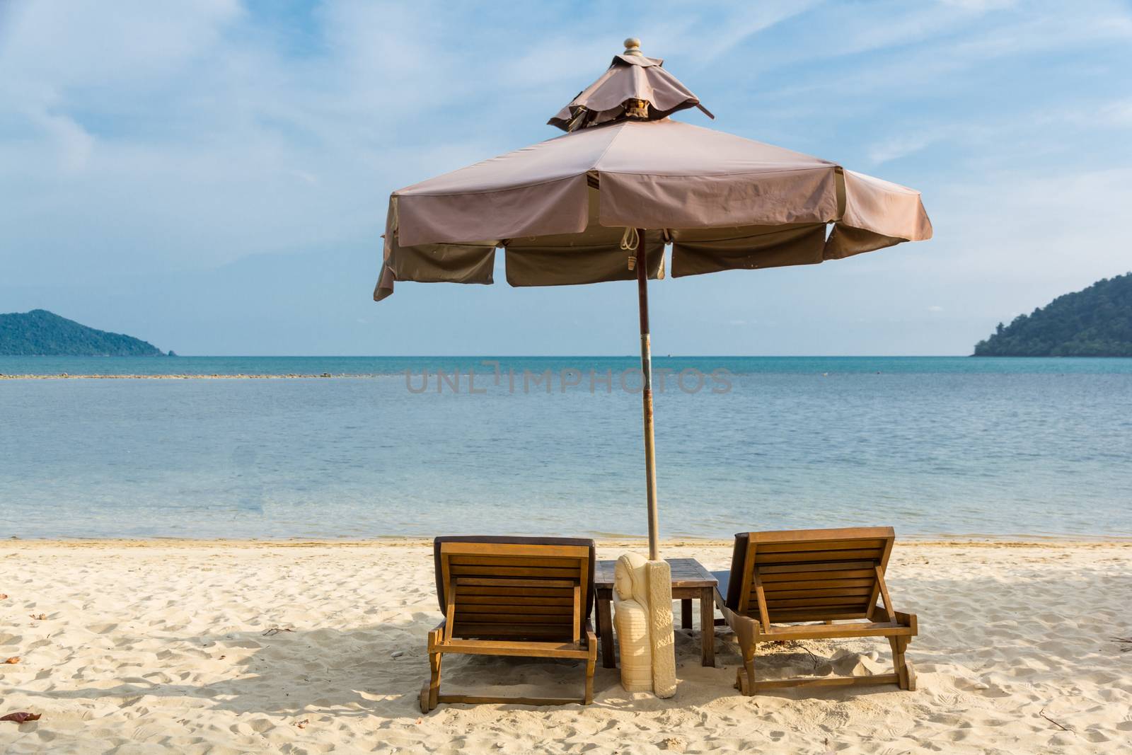 beach chairs and umbrella by prajit48
