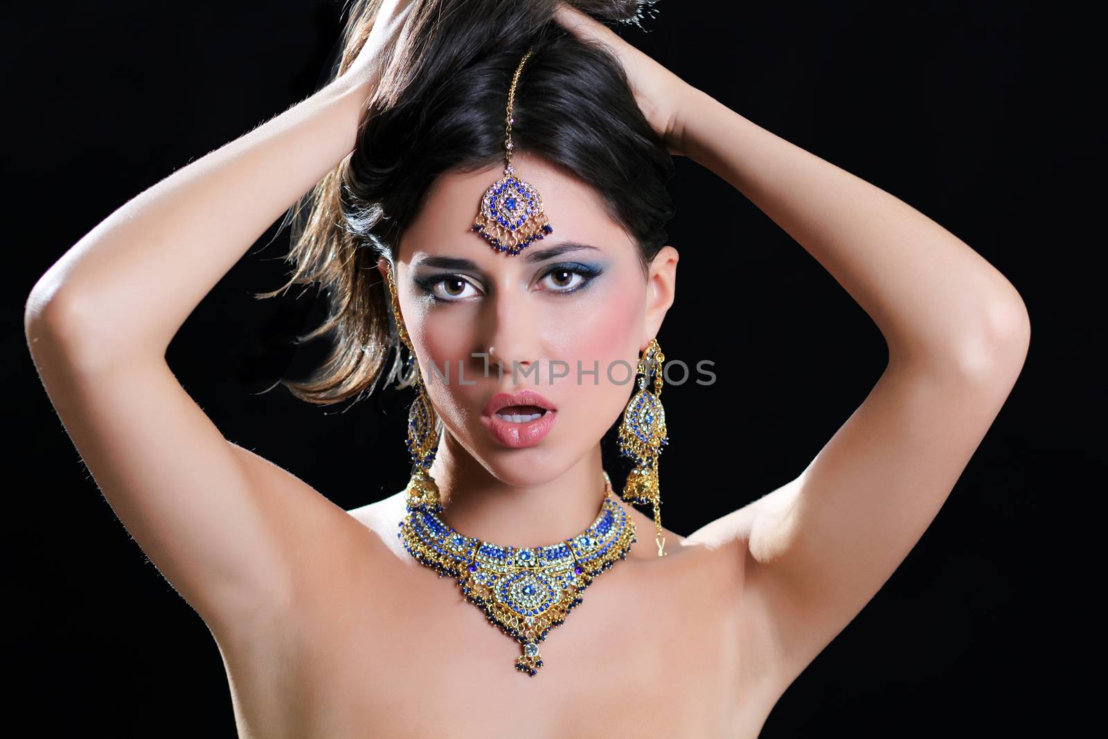 Young beautiful brunette woman in indian blue dress