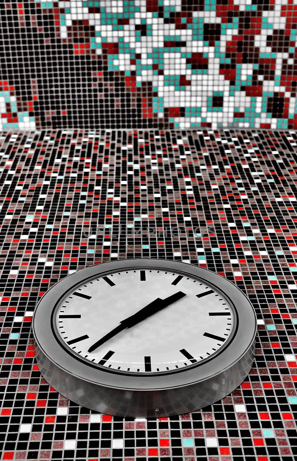 Classic clock on mosaic tiled wall by anderm