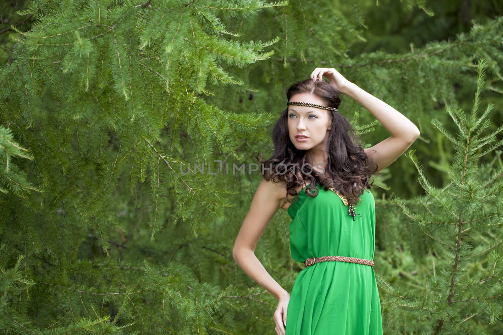 Beautiful young woman in green dress by andersonrise