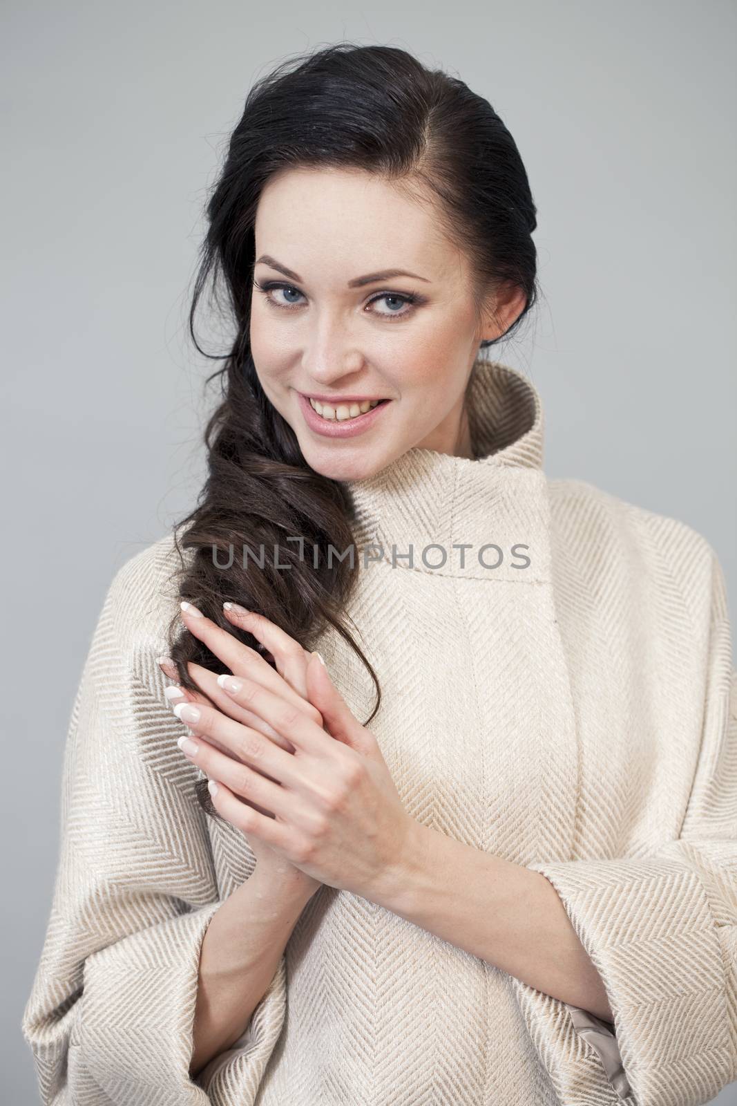 Beautiful young woman in autumn coat by andersonrise