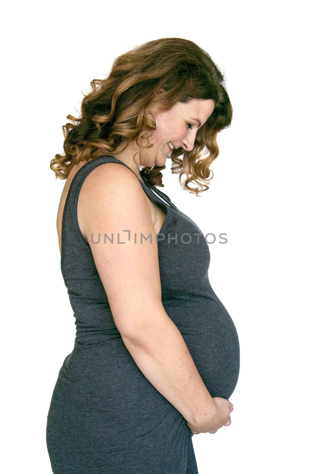 adult pregnant woman holding her hands on her belly