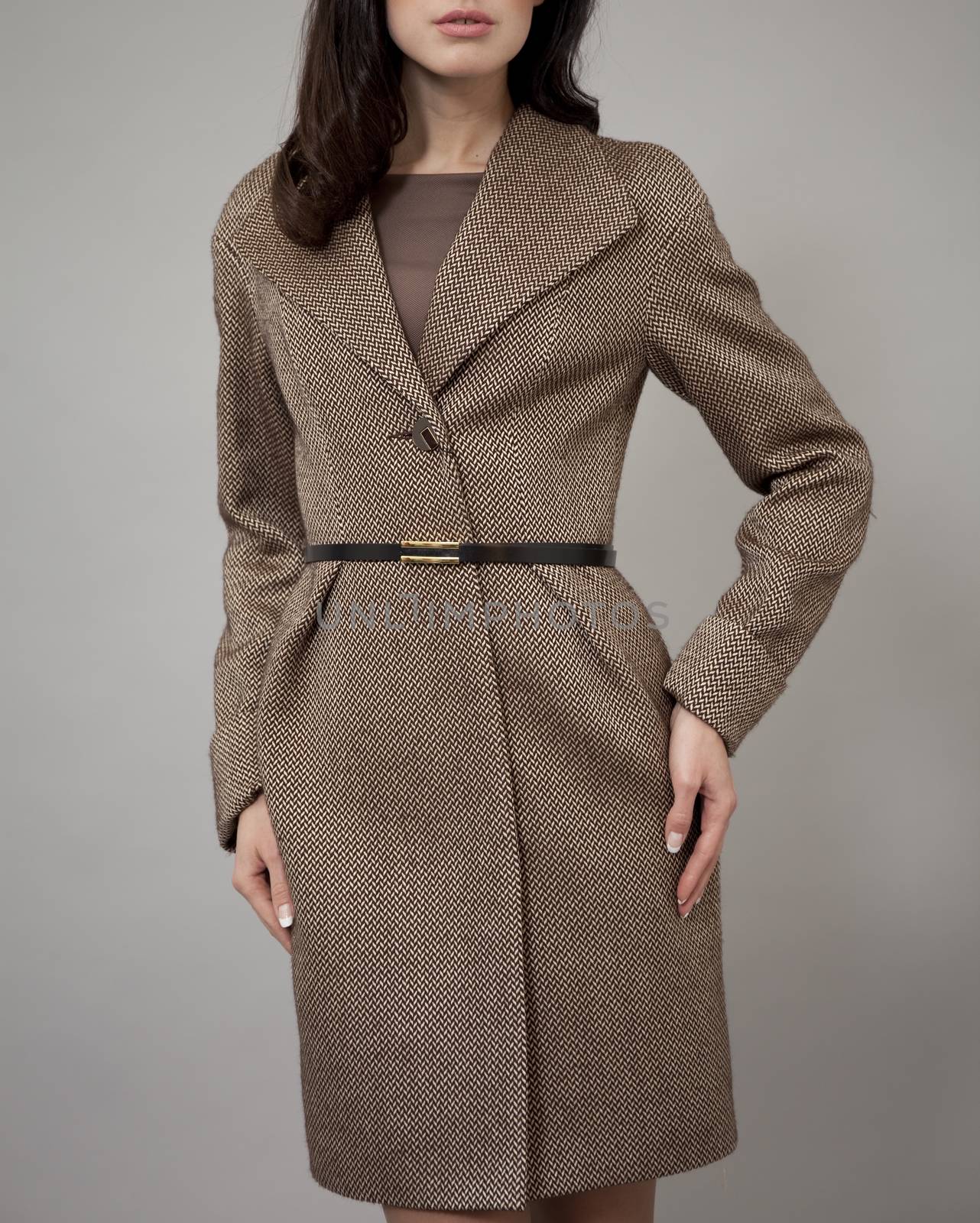 Female autumn coat against gray background