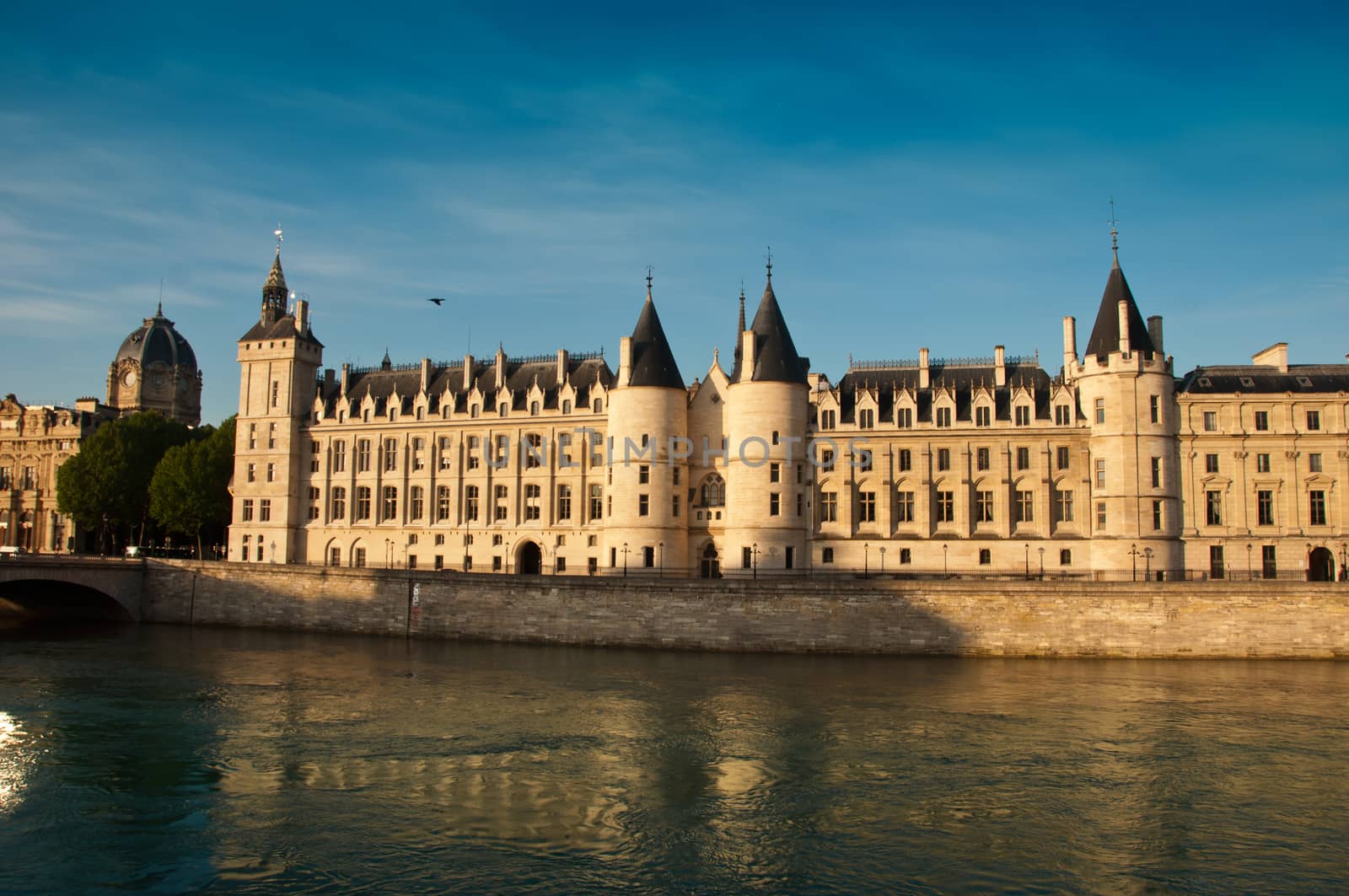 conciergerie castle with Seine river in Paris