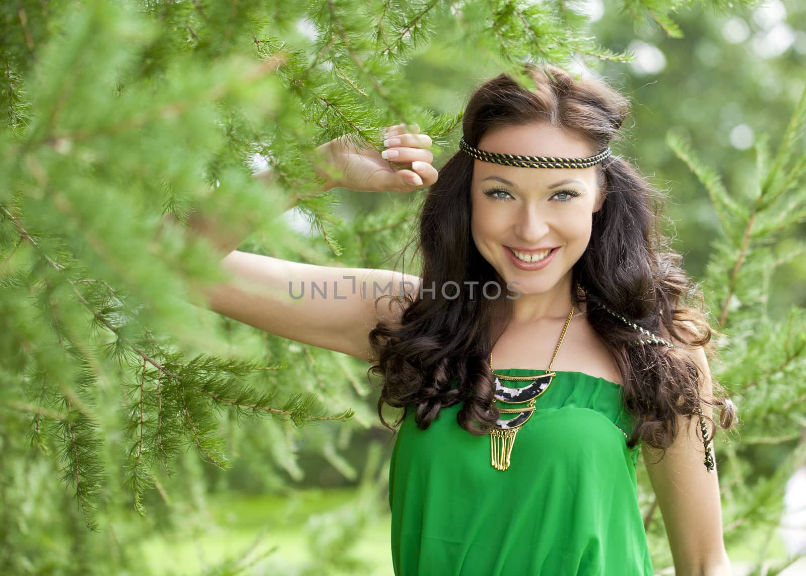 Beautiful young woman in green dress by andersonrise