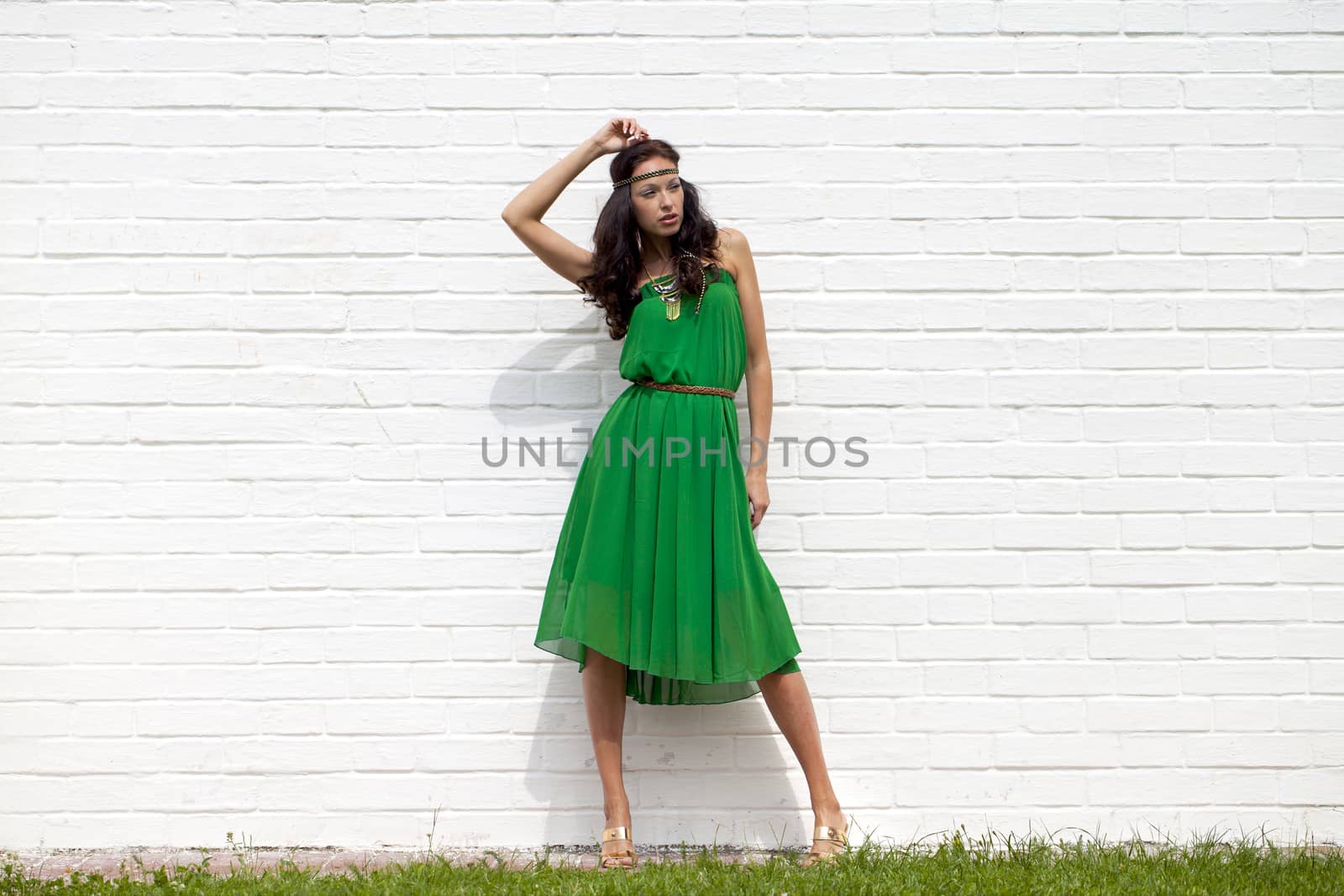 Beautiful young woman in green dress by andersonrise