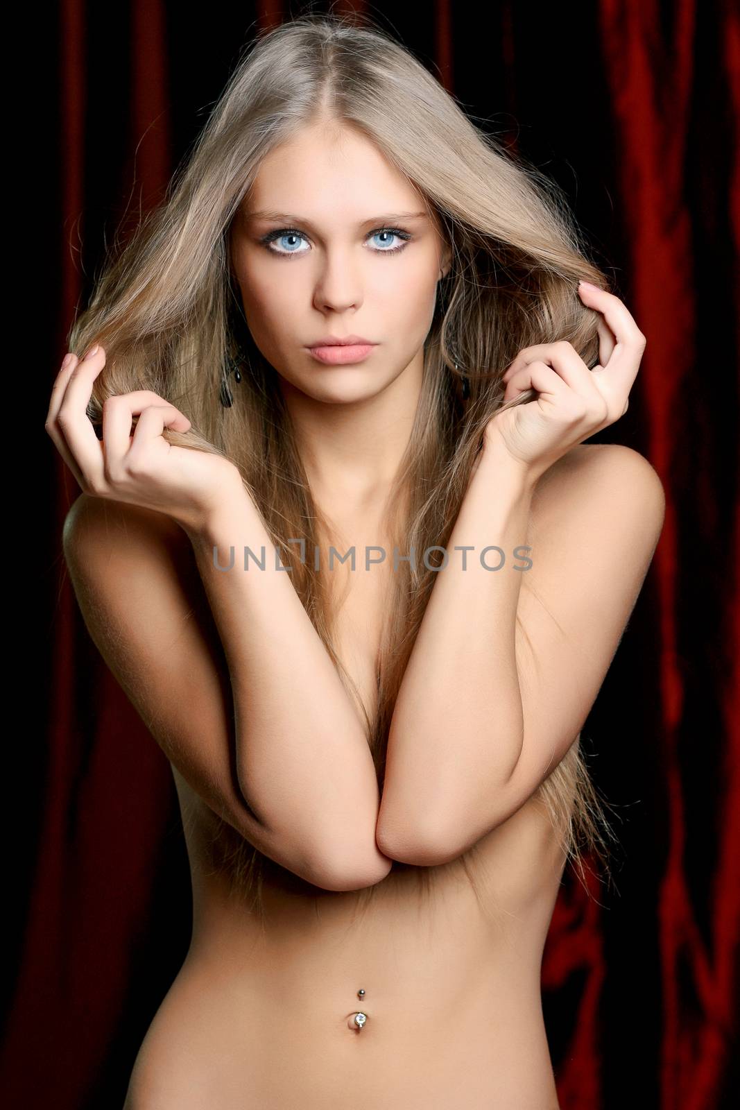 Sexy woman in dark studio by andersonrise