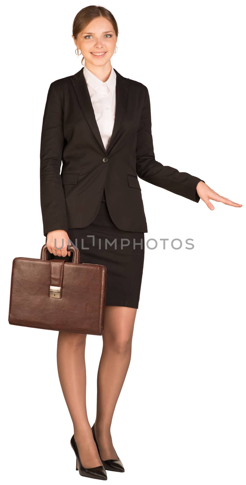 Businesswoman holding a briefcase and shows his hand towards. Isolated on white background