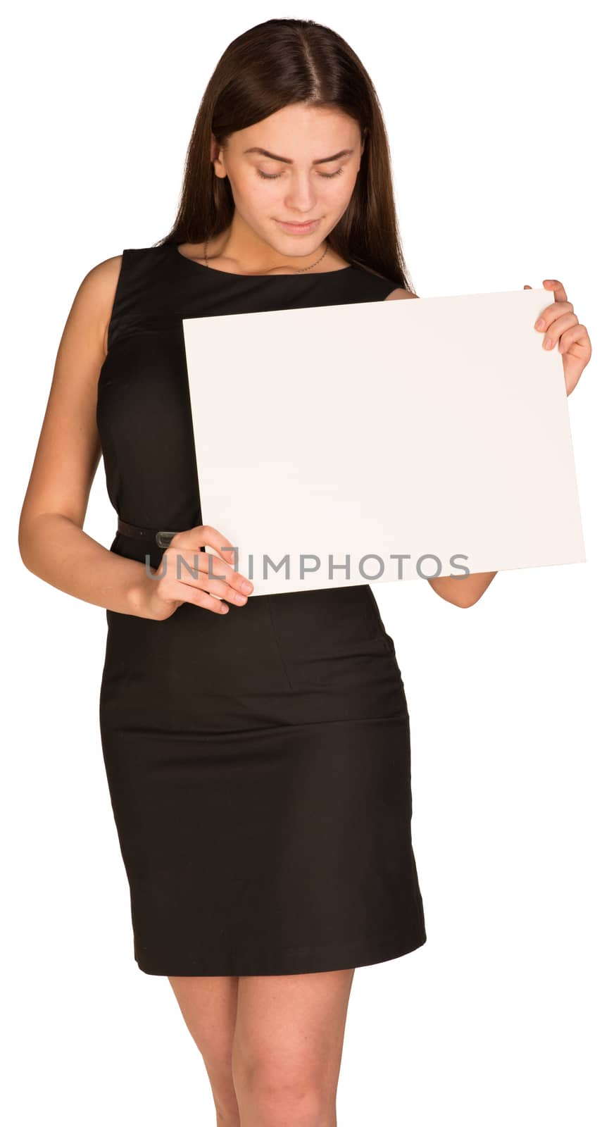 Businesswoman in dress holding and looking at blank white sheet of paper