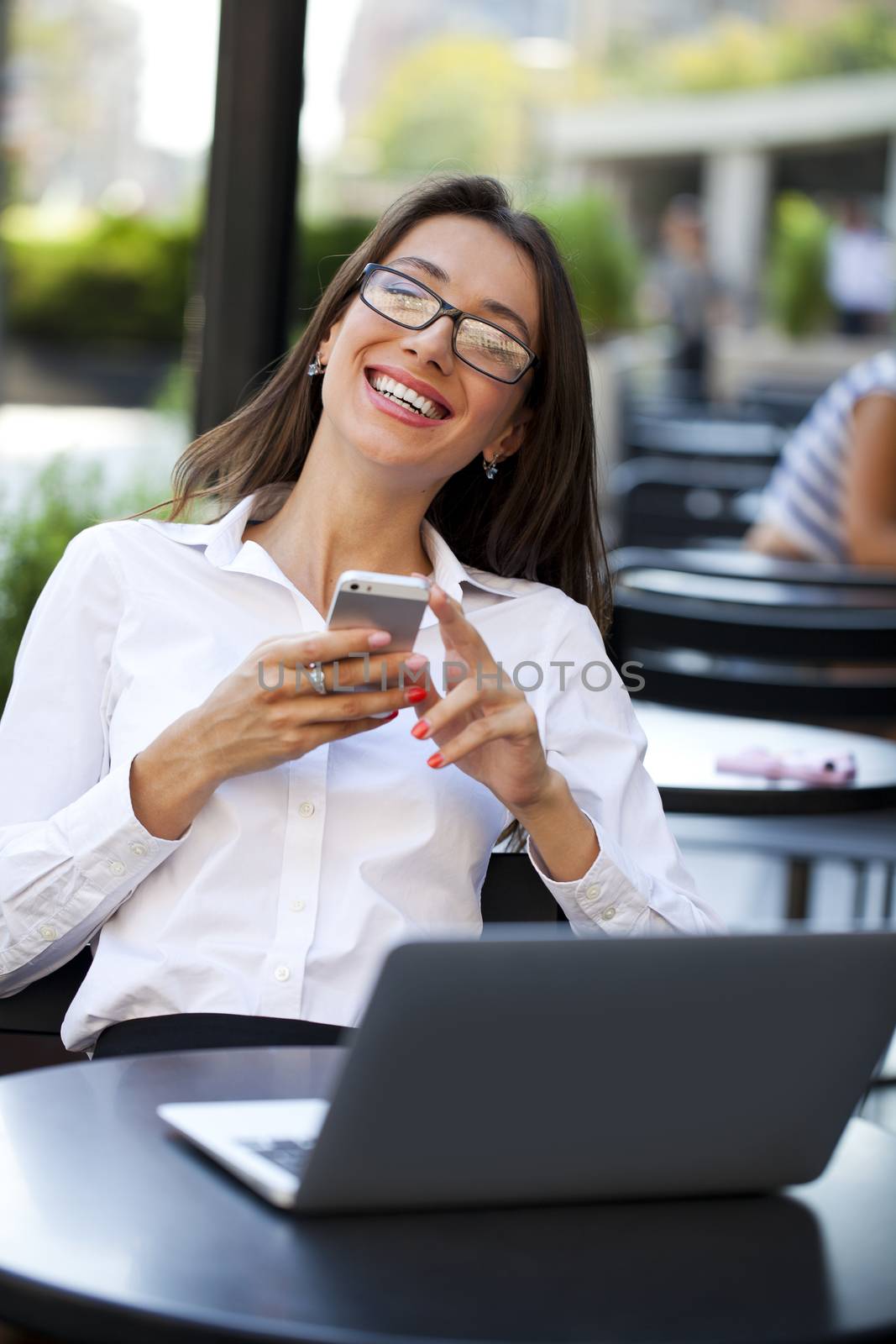 Portrait of young businesswoman working on a laptop