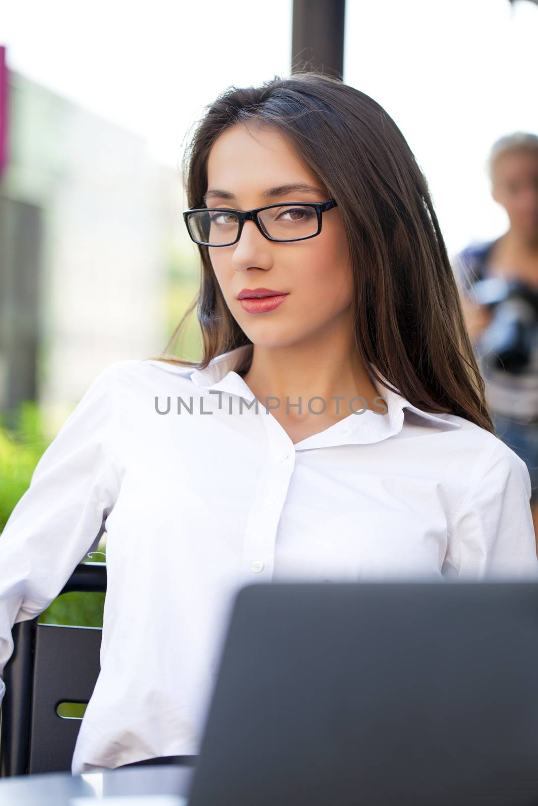 Portrait of young businesswoman working on a laptop