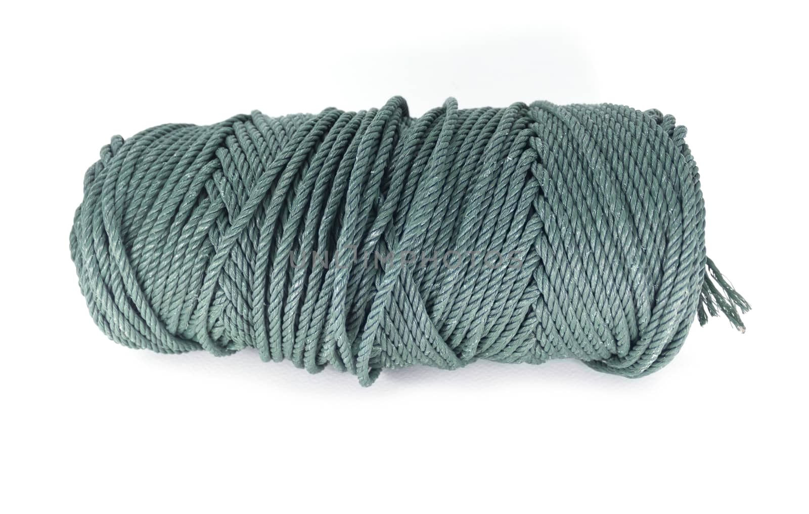 A coil of green rope isolated by dontpoke