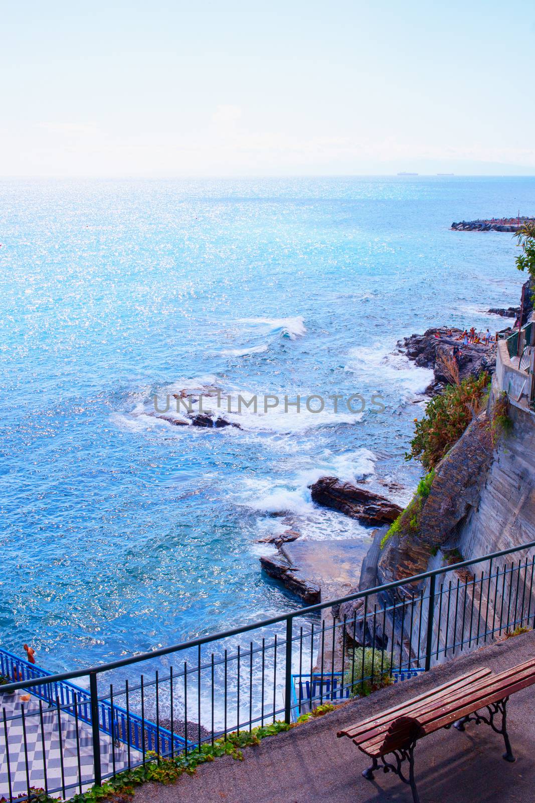 Railing looking at wonderful sea, with bench