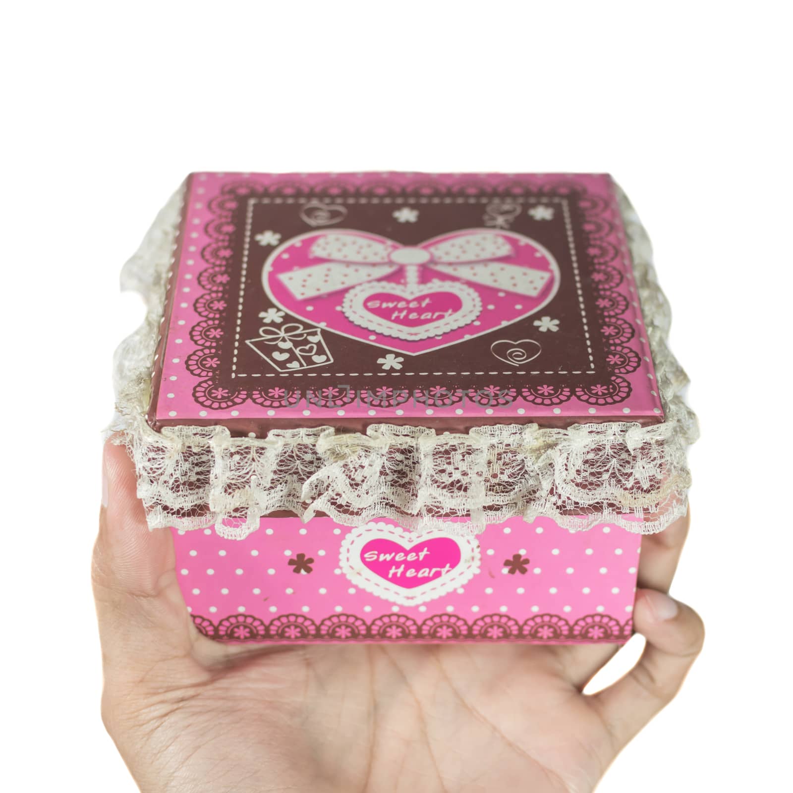 close up of man hands holding a pink gift box on the day of love. isolated on white.