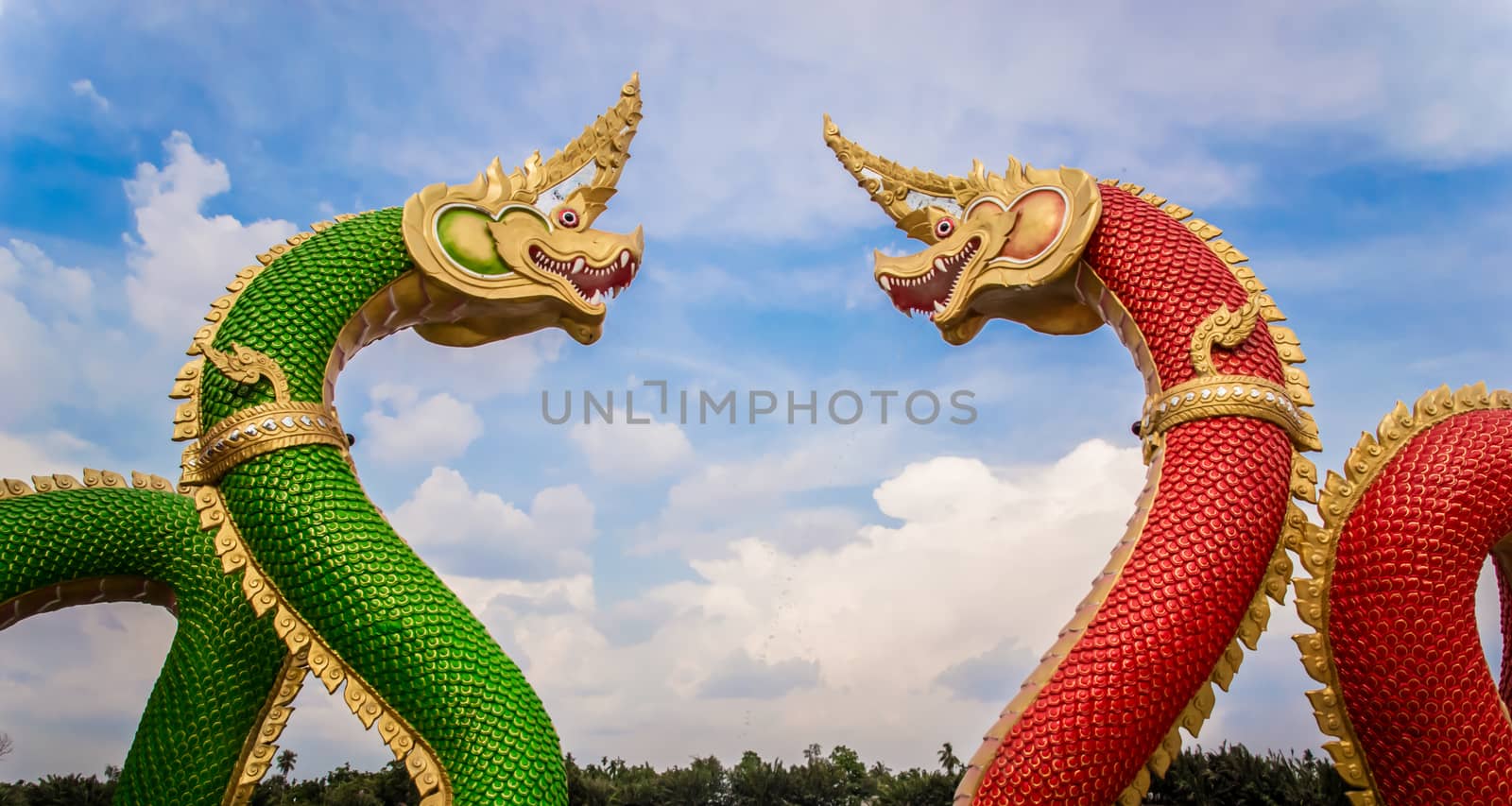 Thai dragon or king of Na-ga statue on blue sky background.