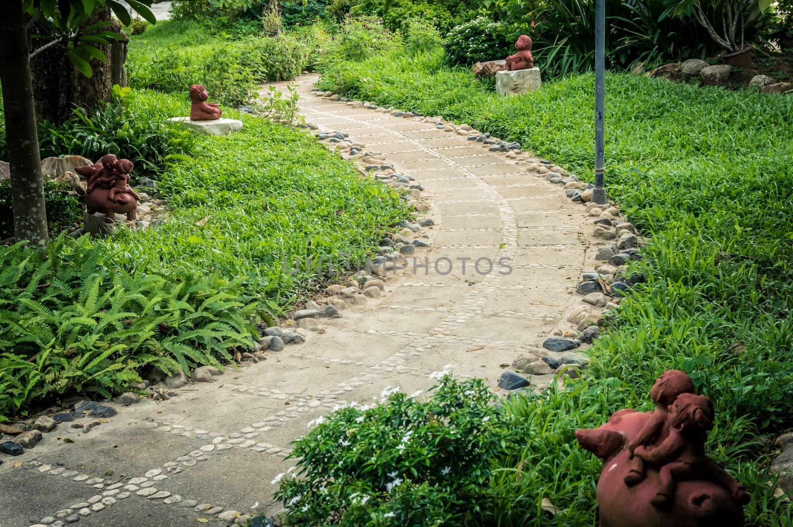 The rock pathway design flowery in garden