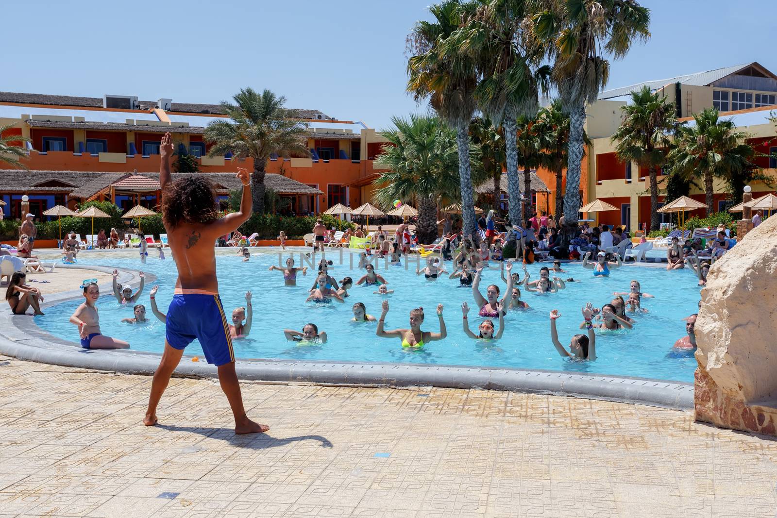 BORJ CEDRIA, TUNISIA - AUGUST 7: Tourists on holiday in an expensive hotel Carribean World are doing water aerobics in pool August 7, 2014 Borj Cedria, Tunisia. 