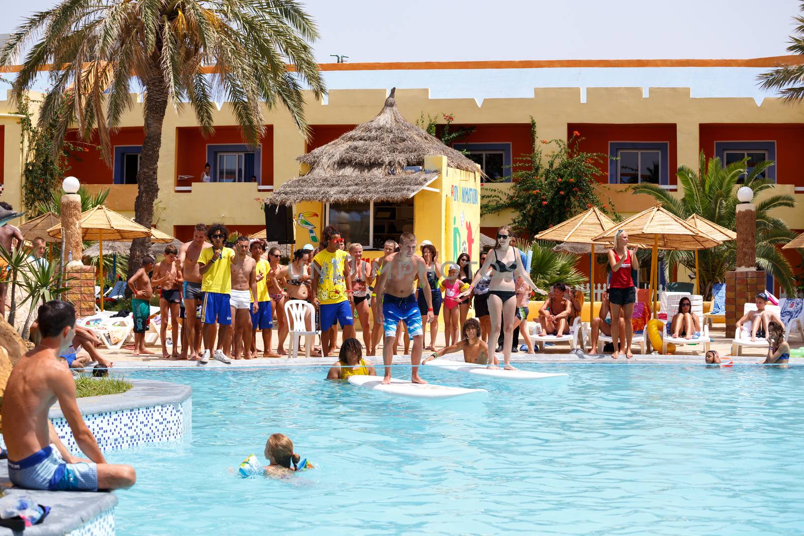 BORJ CEDRIA, TUNISIA - AUGUST 5: Tourists in animation competition program on holiday in an hotel Carribean World in pool August 5, 2014 Borj Cedria, Tunisia. 