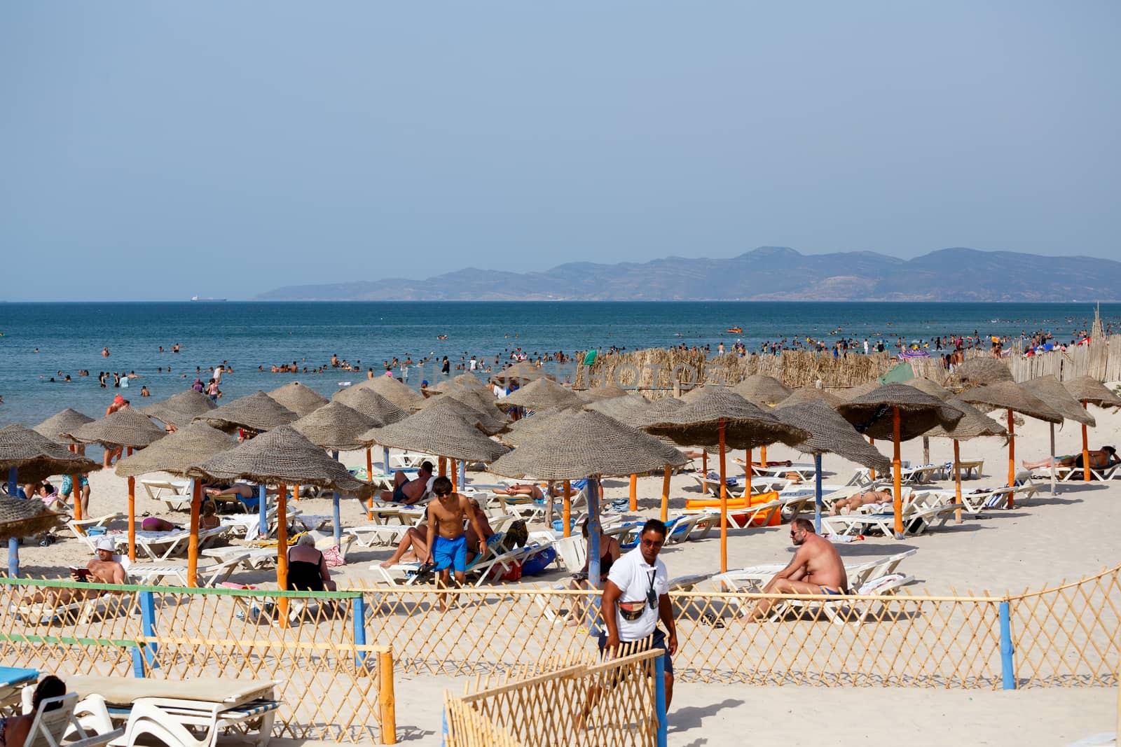 BORJ CEDRIA, TUNISIA - AUGUST 10: People relaxing at hotel beach. Club Caribbean also offers, large outdoor pool, excellent entertainment team and children�s club. August 10, 2014 Borj Cedria, Tunisia.