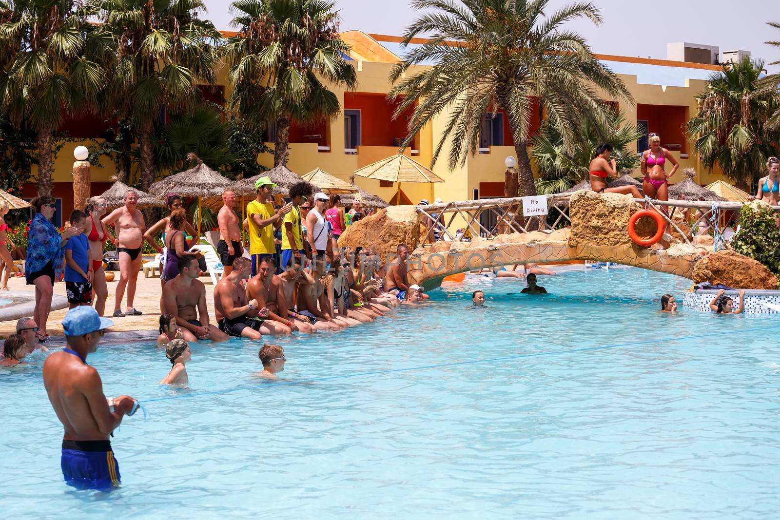 BORJ CEDRIA, TUNISIA - AUGUST 5: Tourists in animation competition program on holiday in an hotel Carribean World in pool August 5, 2014 Borj Cedria, Tunisia. 