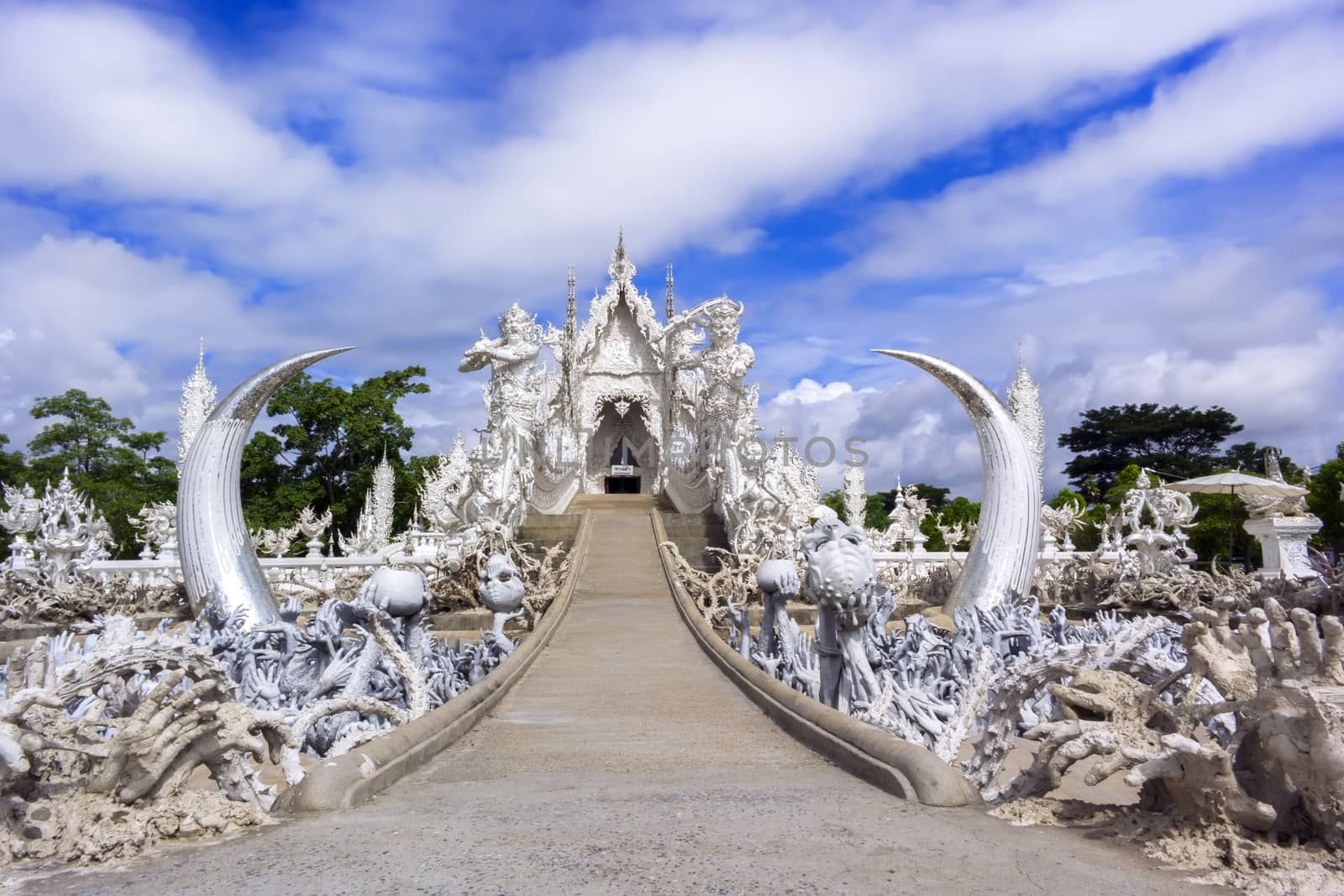 Road to White Temple, is a contemporary unconventional Buddhist temple in Chiang Rai, Thailand.