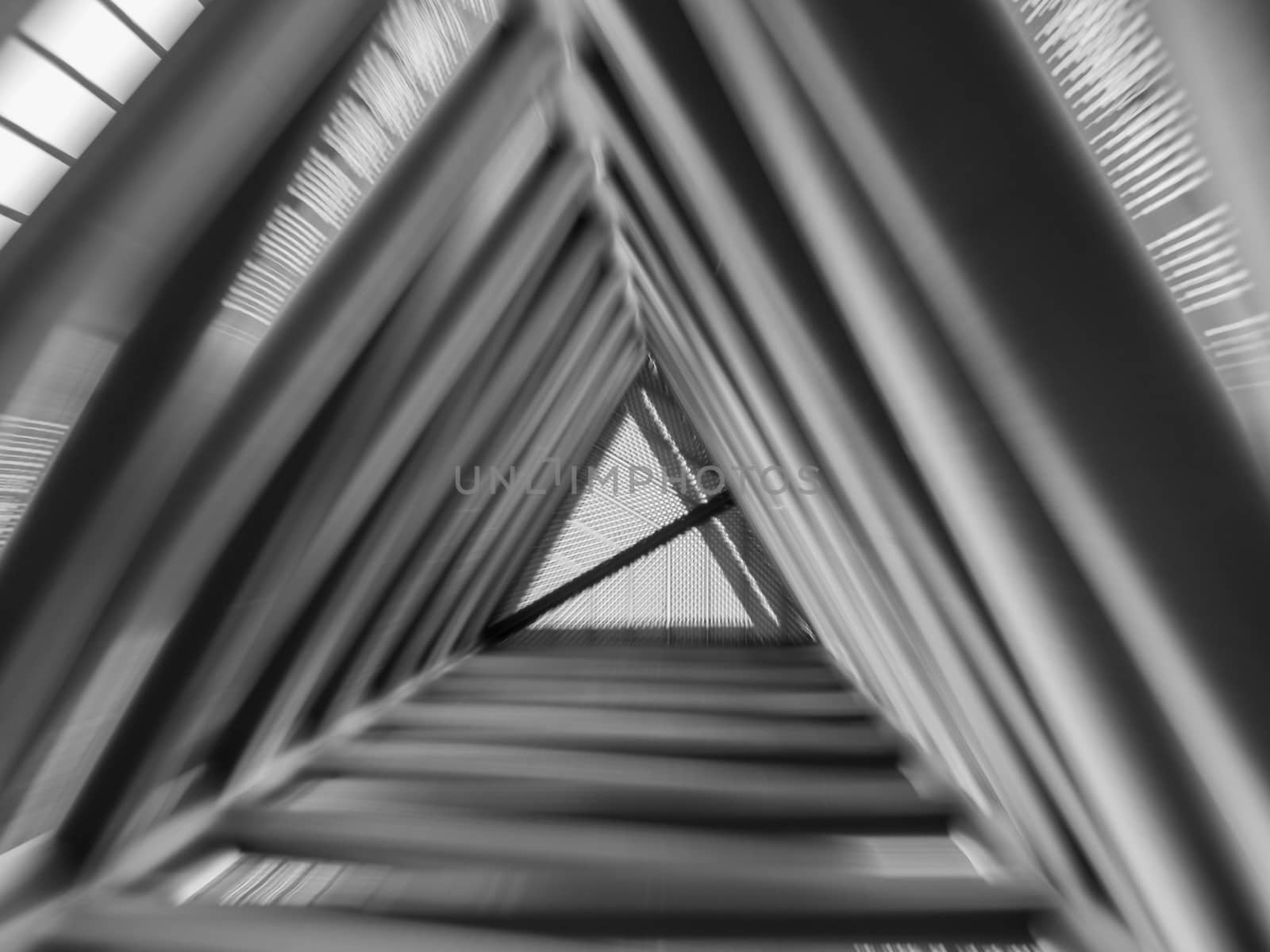 Zoom effect looking up through triangle structure