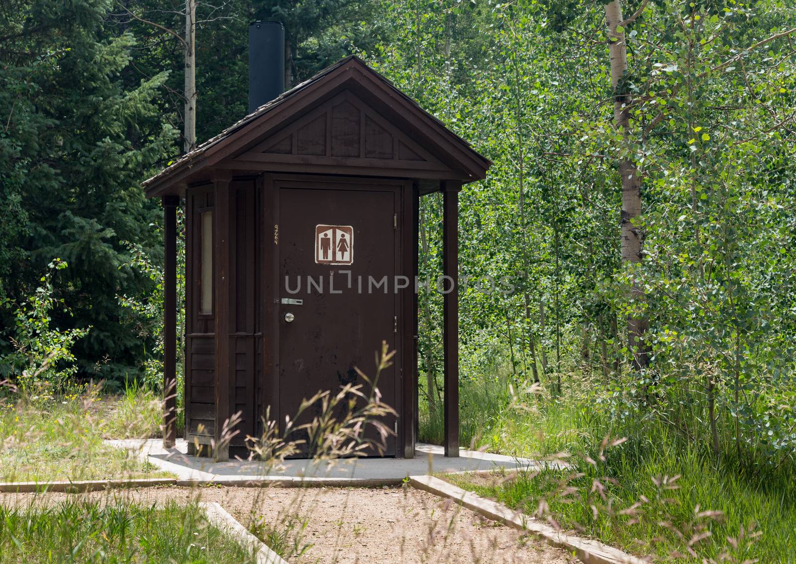 Wooden restroom or toilet building in remote forest in National park in USA