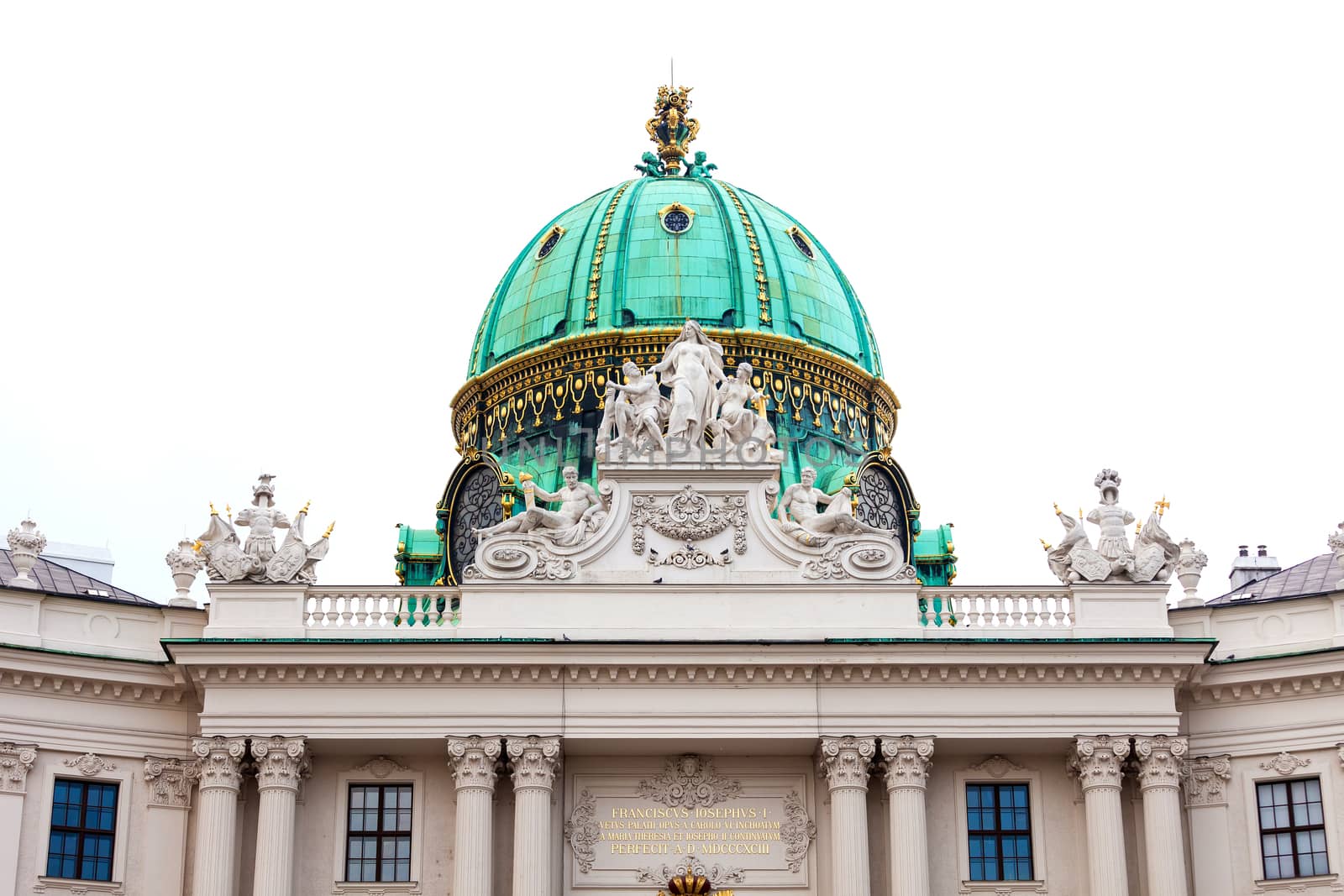 VIENNA, AUSTRIA - AUGUST 4, 2013: Hofburg palace cupola with decoratice sculptures on roof, Vienna, Austria.