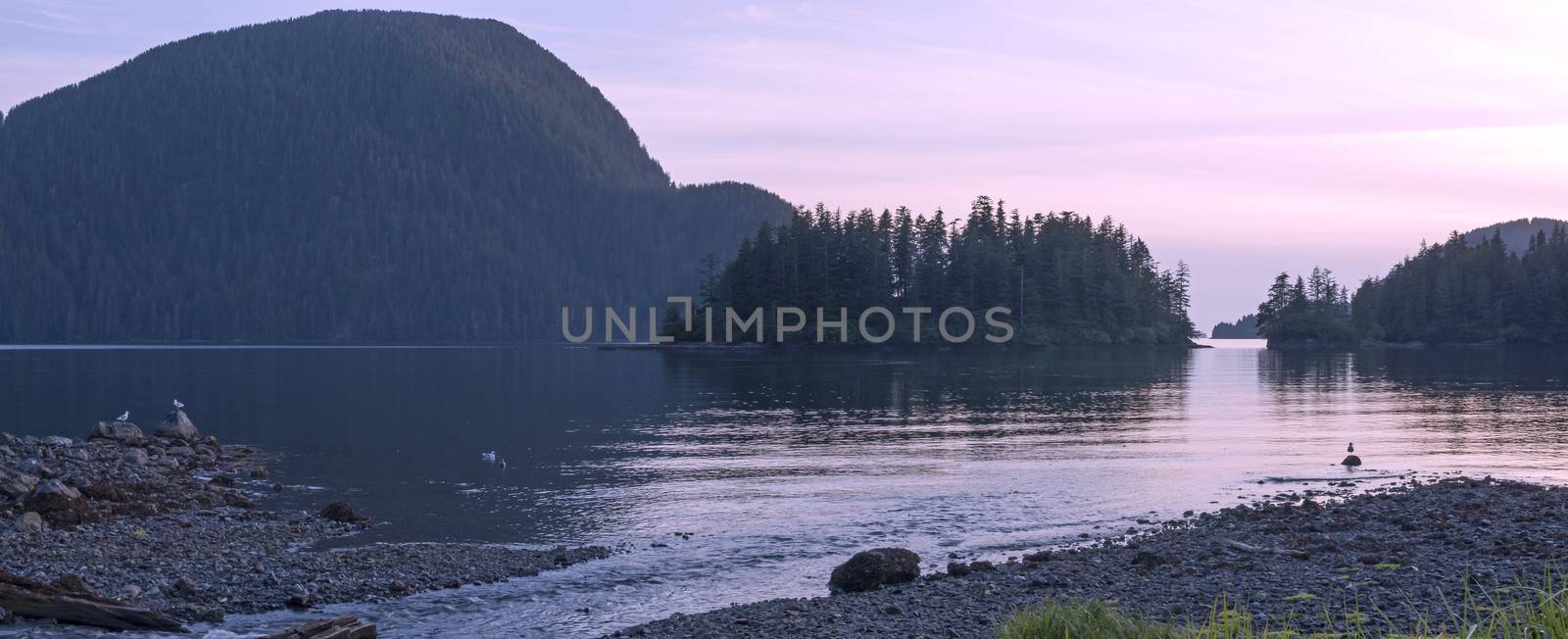 Beautiful panoramic scenic seascape on beach of Herring Cove in Silver Bay near Sitka, Alaska at sunset