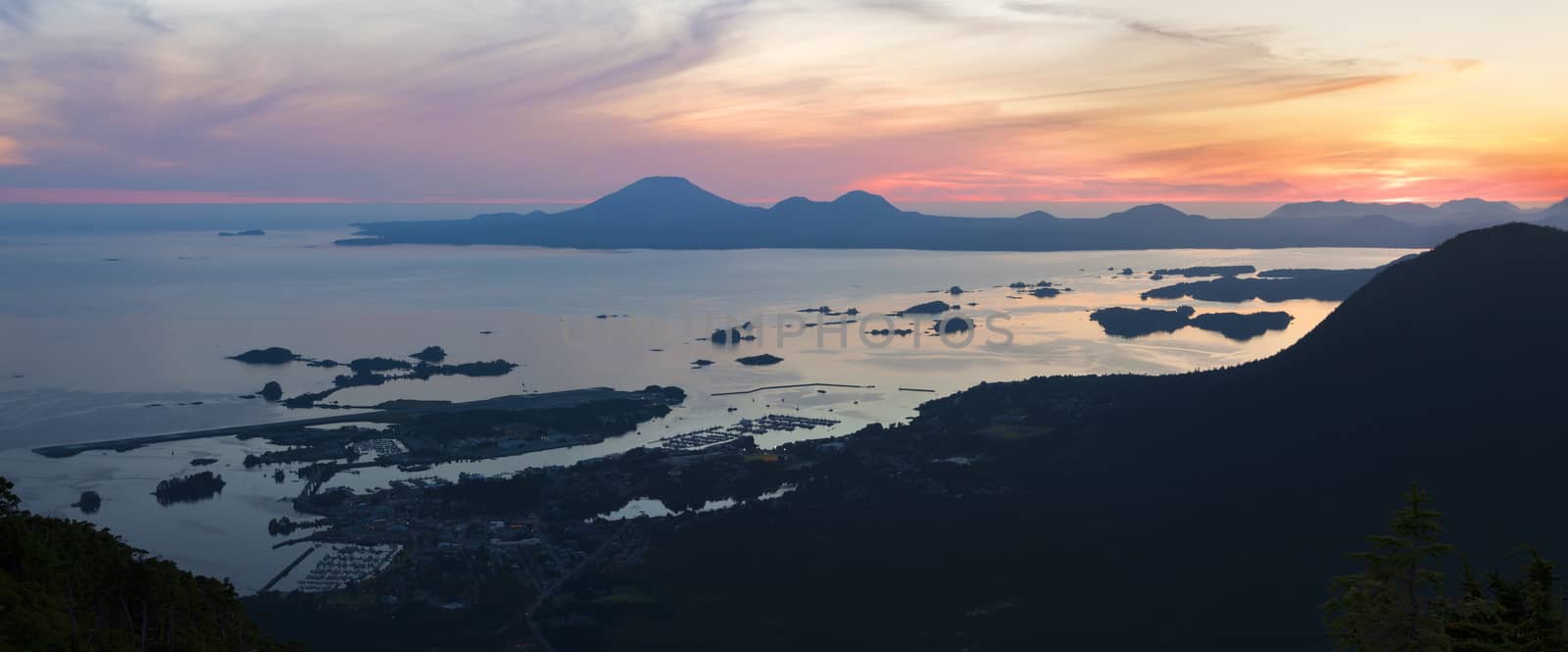 Beautiful panoramic and colorful sunset sky over Sitka Sound with view of Sitka and Mount Edgecumbe from Mount Verstovia peak