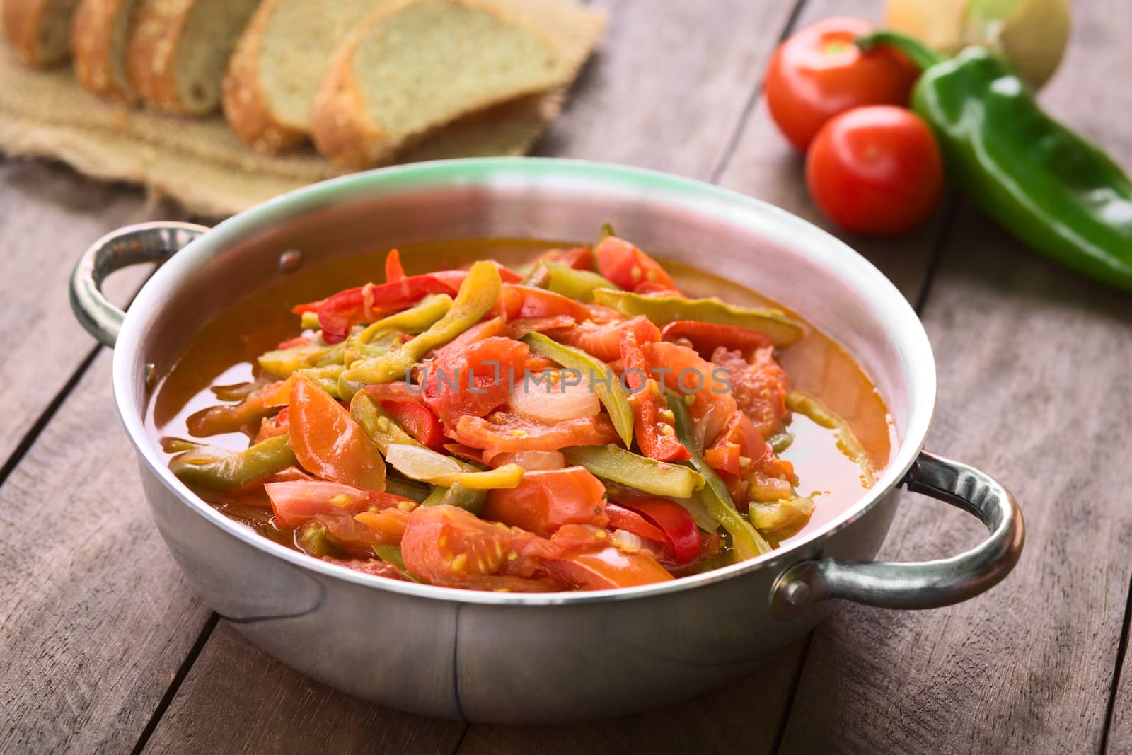 Hungarian traditional dish called Lecso, a vegetarian stew made of onion, pepper and tomato, seasoned with salt and pepper. It can be accompanied by bread or rice (Selective Focus, Focus in the middle of the dish)  