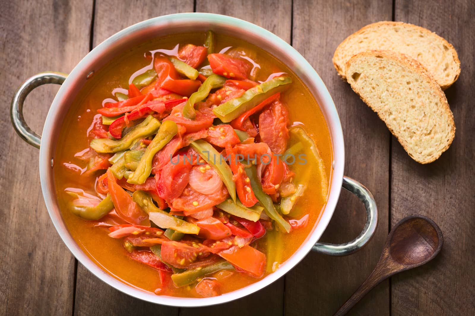 Hungarian traditional dish called Lecso, a vegetarian stew made of onion, pepper and tomato, seasoned with salt and pepper. It can be accompanied by bread or rice (Selective Focus, Focus in the middle of the dish)  