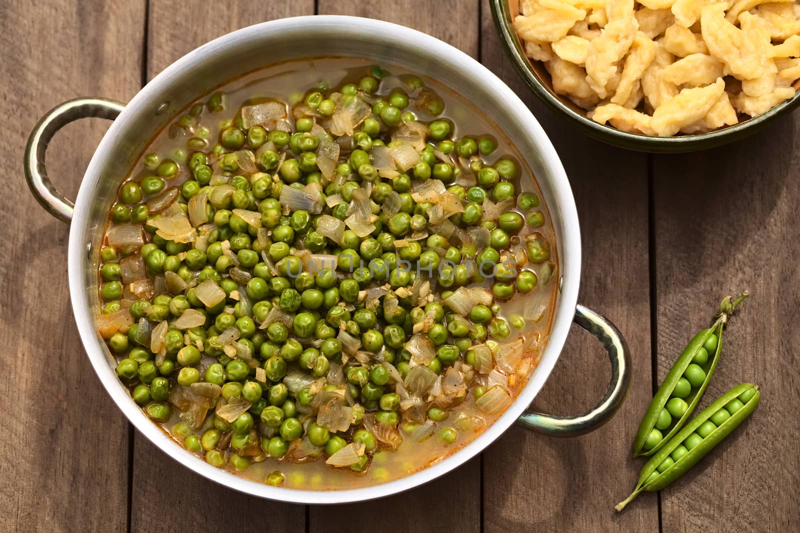 Hungarian pea stew made of onion and peas and seasoned with paprika and salt, served usually with Hungarian galuska or nokedli (homemade noodles) (Selective Focus, Focus on the middle and lower part of the stew)