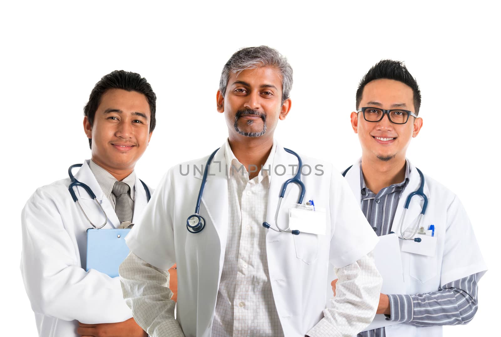 Multiracial doctors / diverse medical team standing isolated on white background