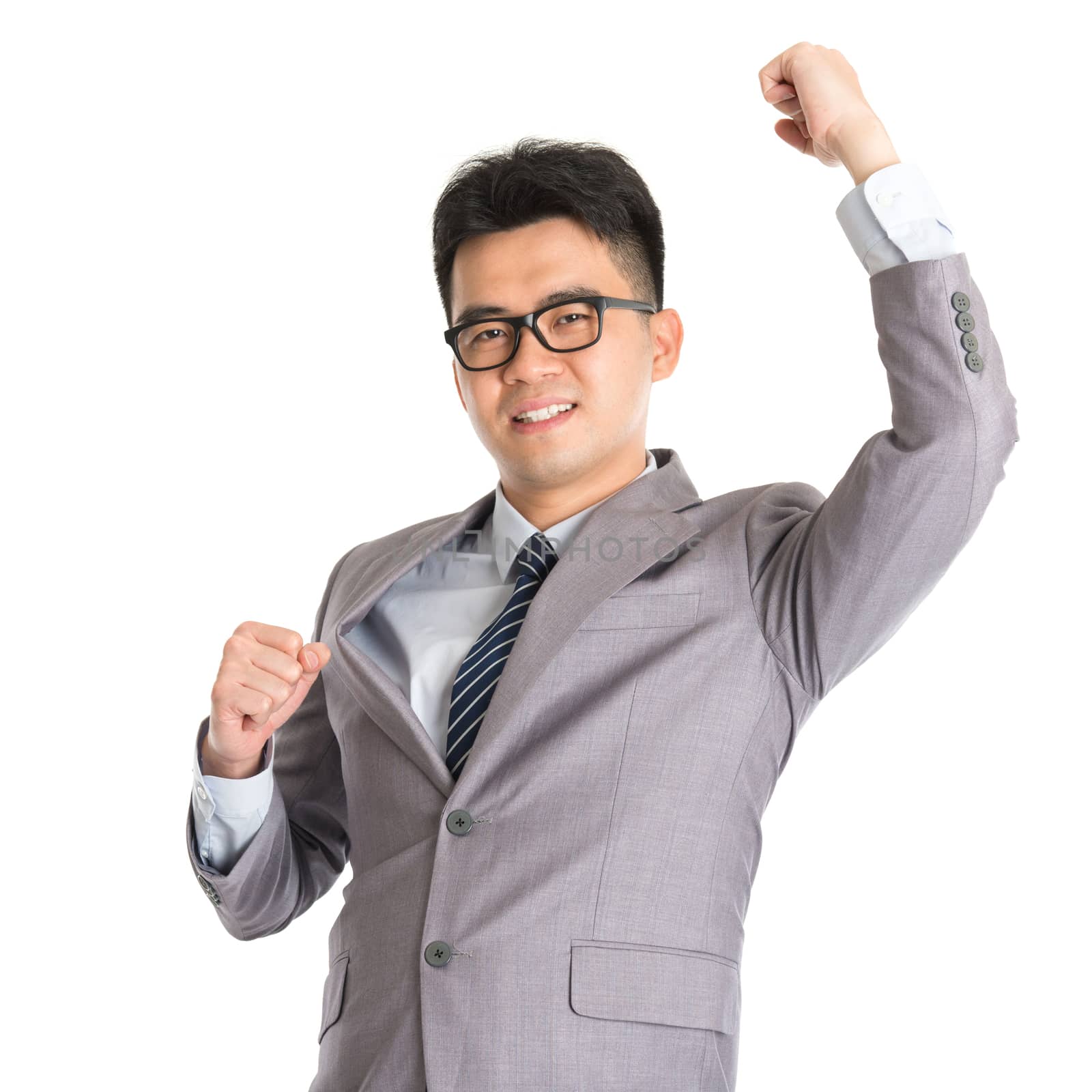 Portrait of Asian businessman celebrating success, isolated on white background.