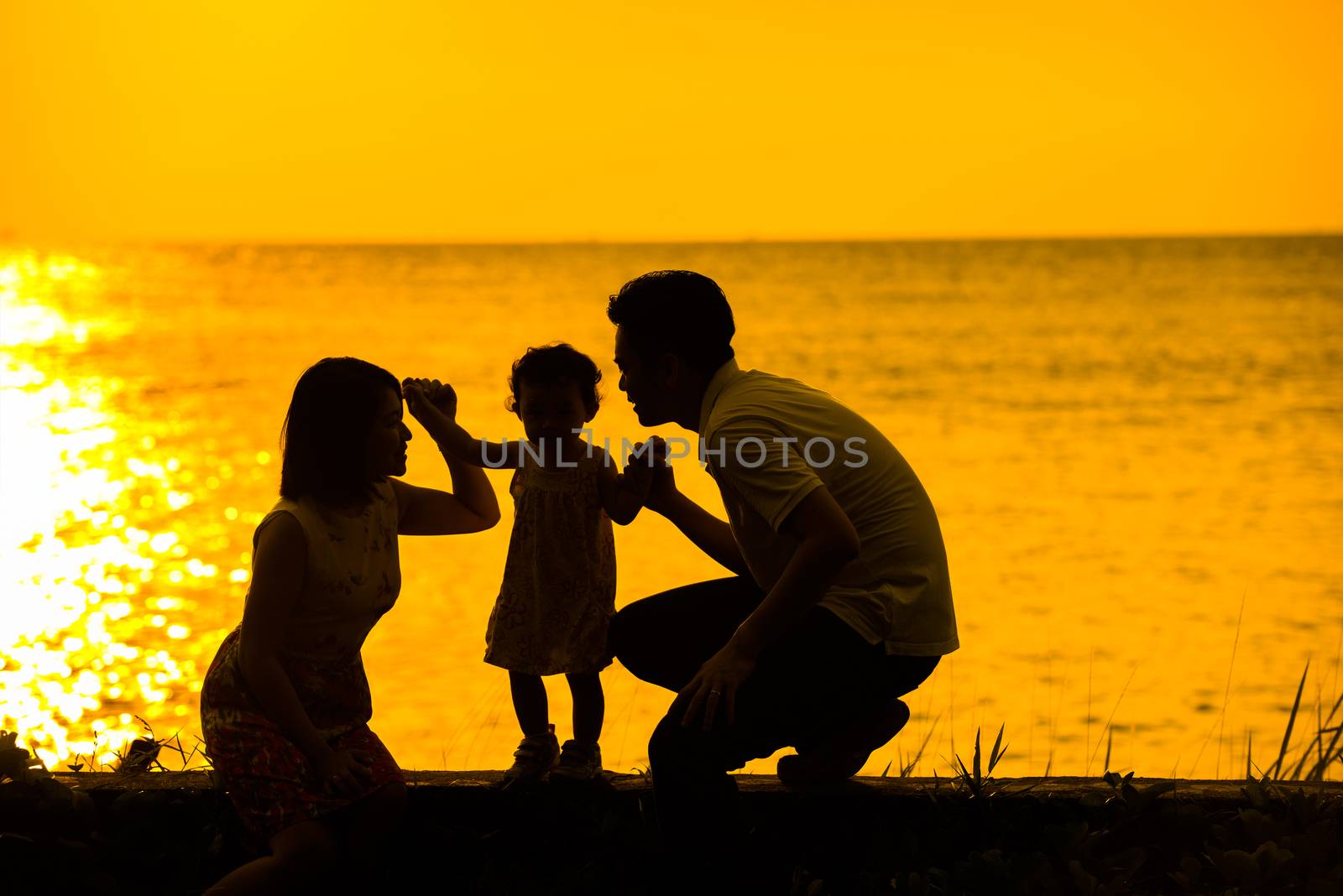 Asian family outdoor sunset beach by szefei