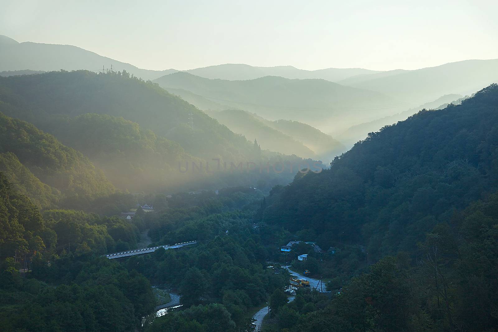 Morning sun's rays in the mountain gorge