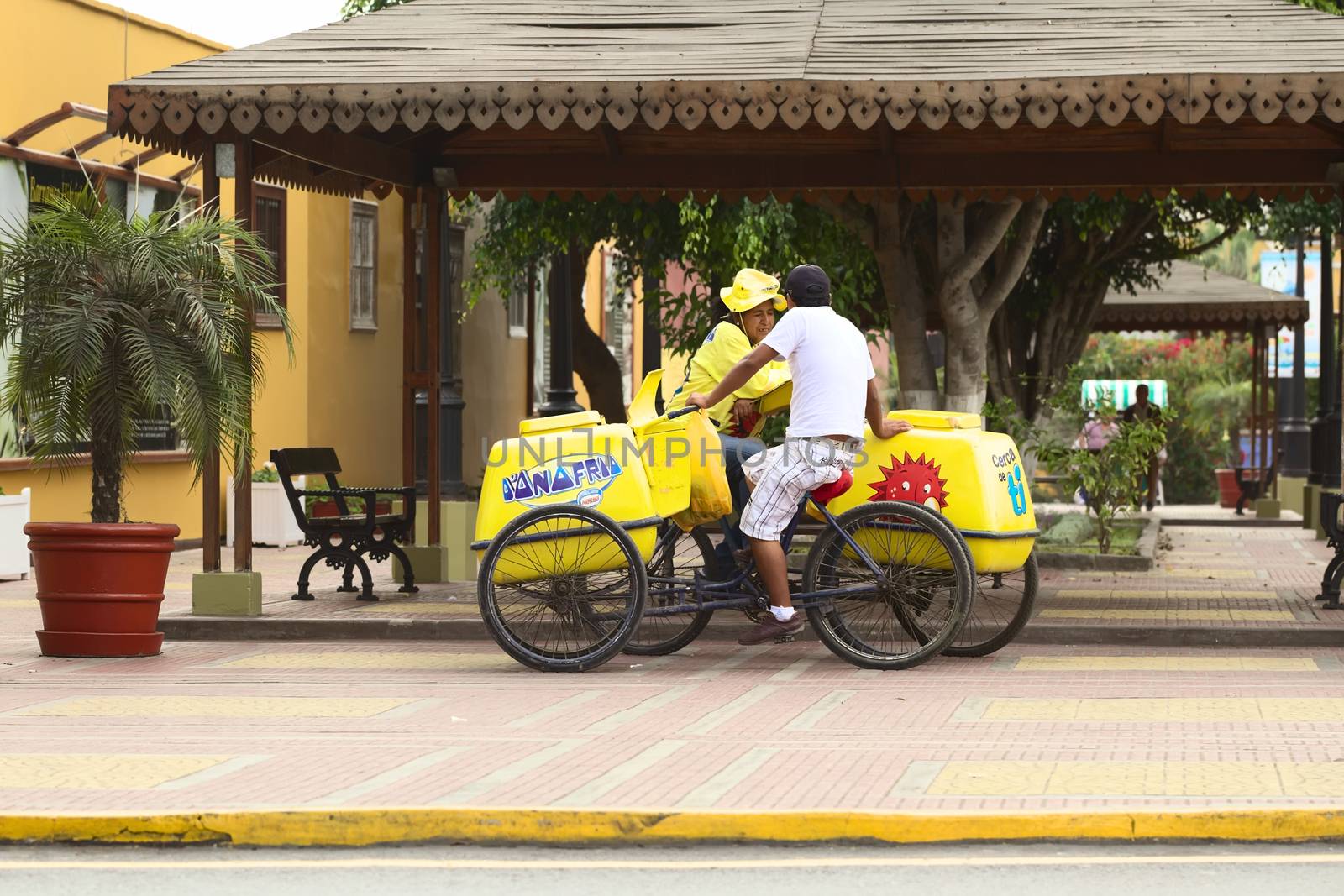 LIMA, PERU - APRIL 19, 2012: Unidentified mobile ice cream vendors with D'Onofrio ice cream carts standing close to the Municipality building along Pedro de Osma Avenue in the district of Barranco on April 19, 2012 in Lima, Peru. 