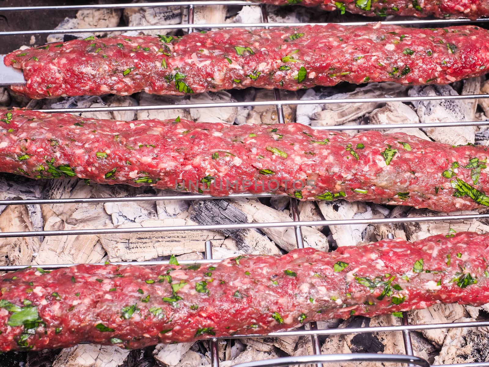 Closeup of shish kebab over hot charcoal barbecue