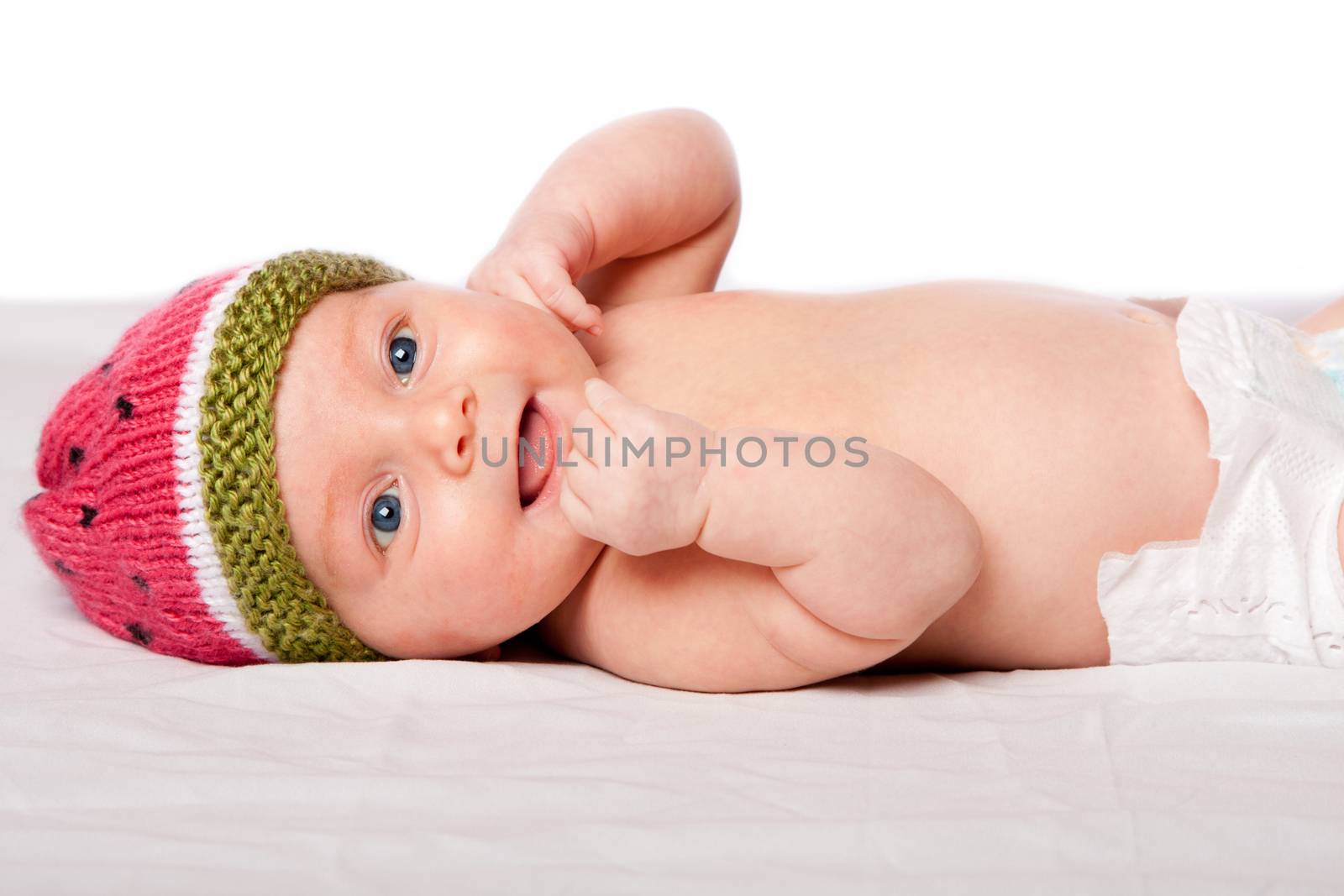 Happy baby infant with hat by phakimata