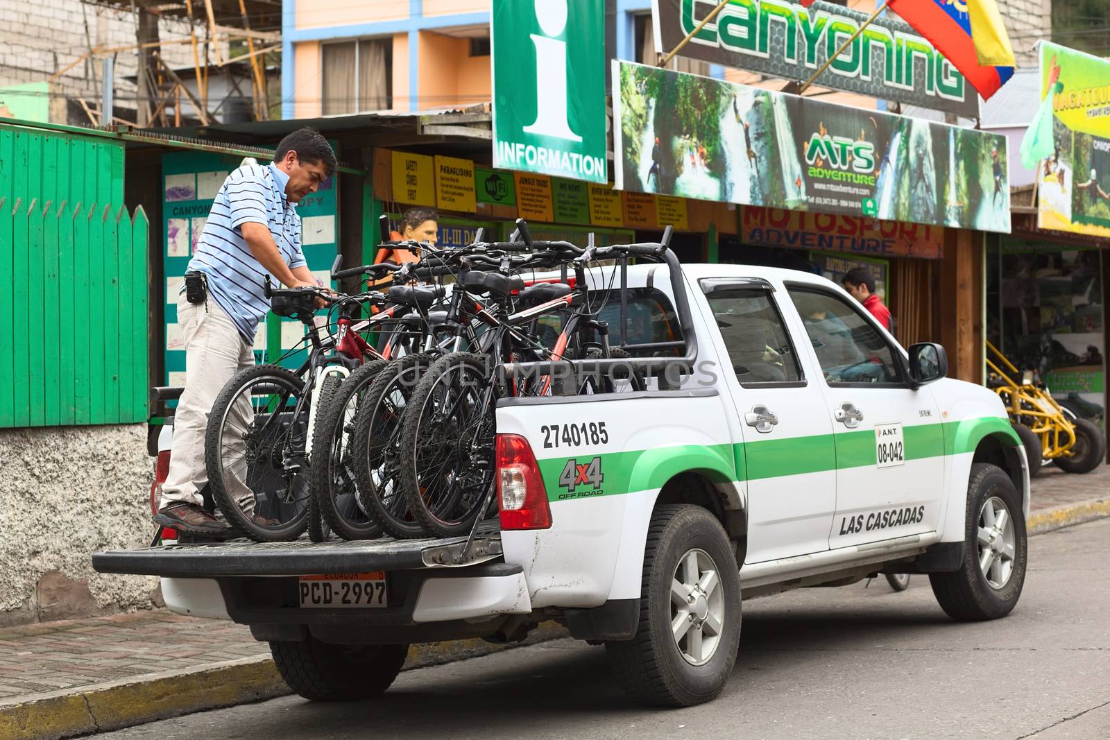 Man and Bikes on Pickup Truck in Banos, Ecuador by ildi