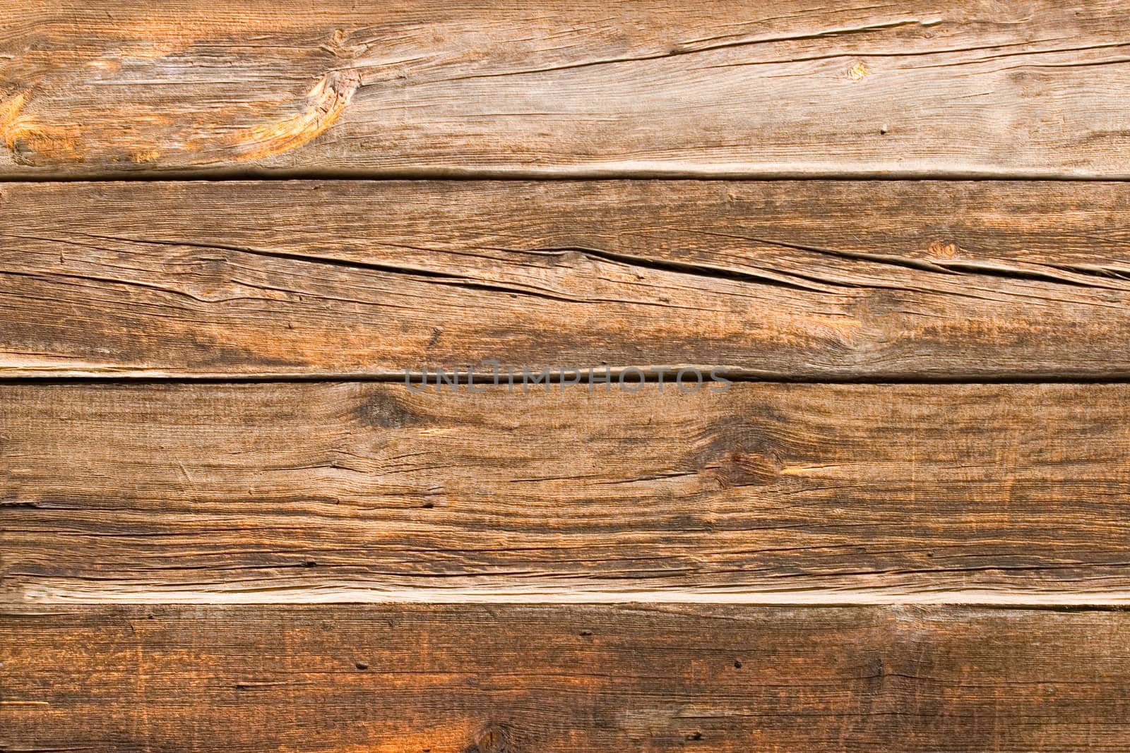 Wall of an old house from a wooden bar.