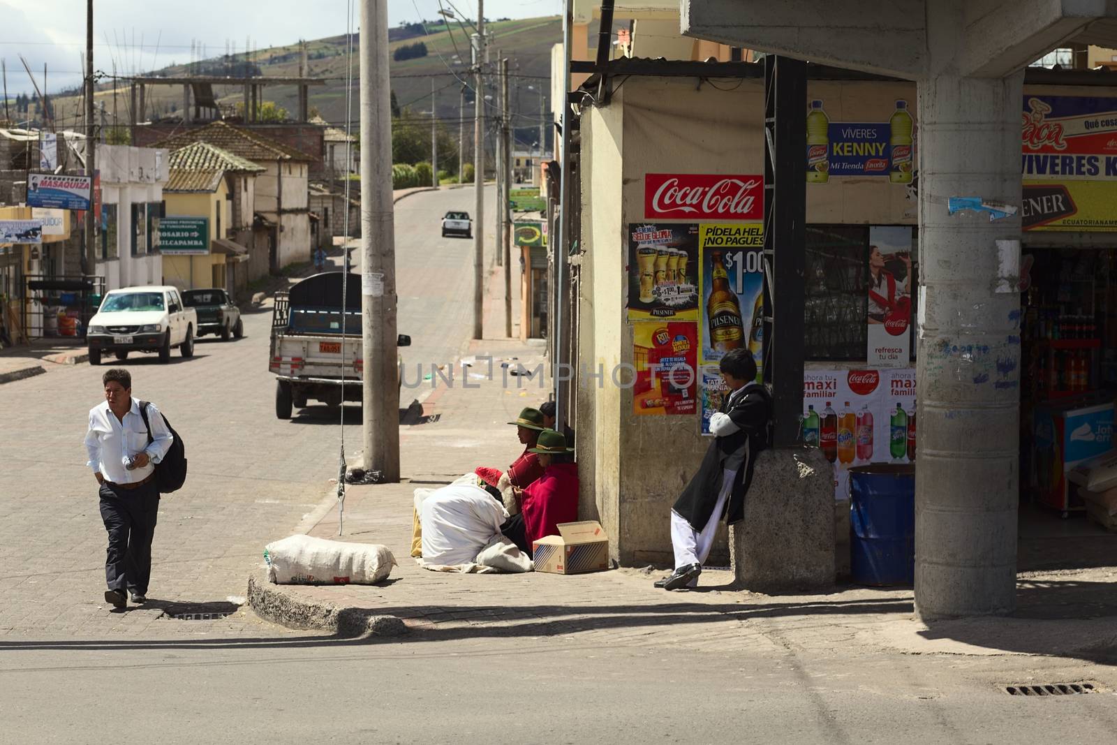TUNGURAHUA PROVINCE, ECUADOR - JULY 29, 2014: Unidentified people on the street in a settlement along the road between Ambato and Banos on July 29, 2014 in Ecuador. 