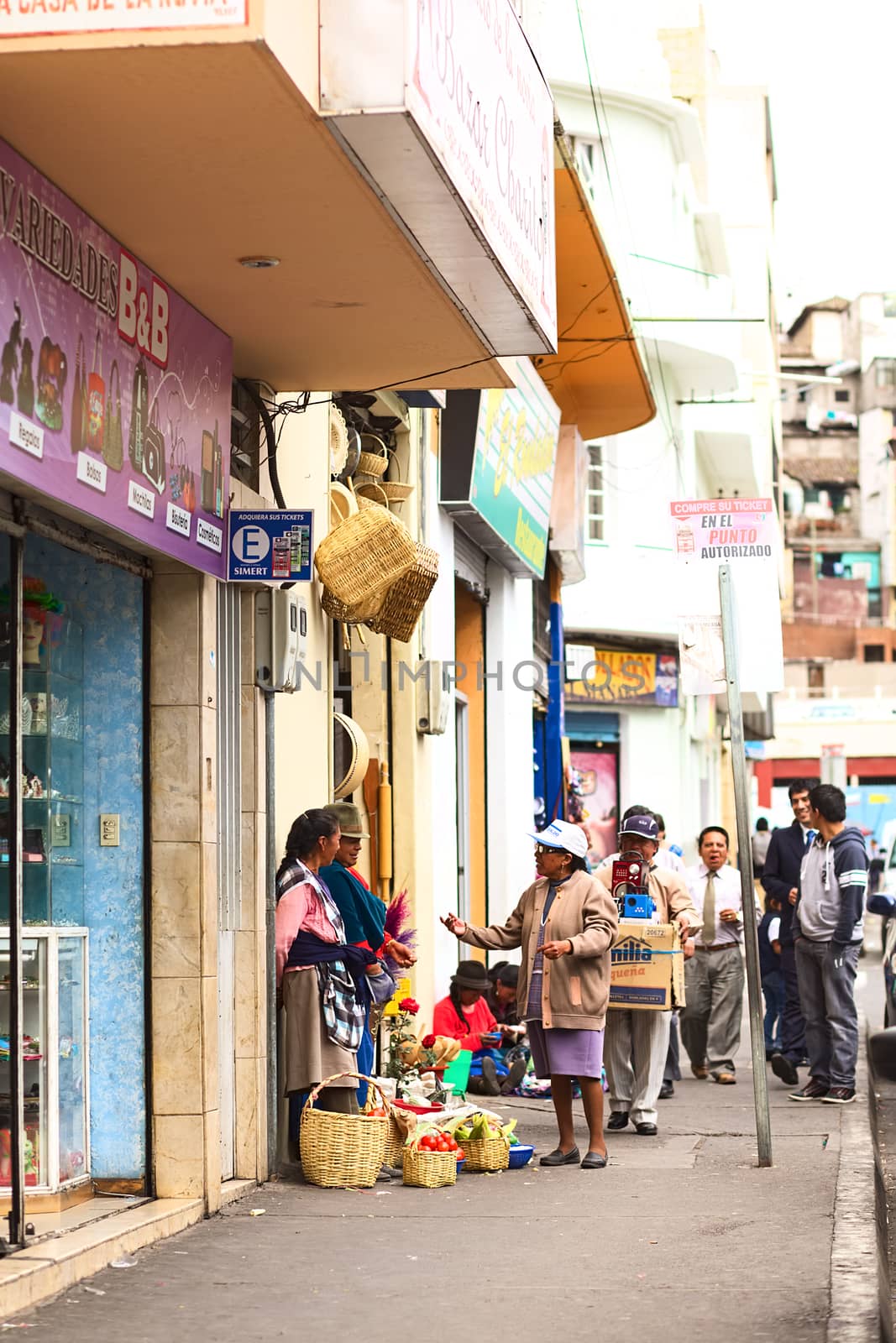 AMBATO, ECUADOR - APRIL 9, 2014: Unidentified people selling vegetables on Martinez Street on April 9, 2014 in Ambato, Ecuador. Ambato is the capital of Tungurahua Province in Central Ecuador.
