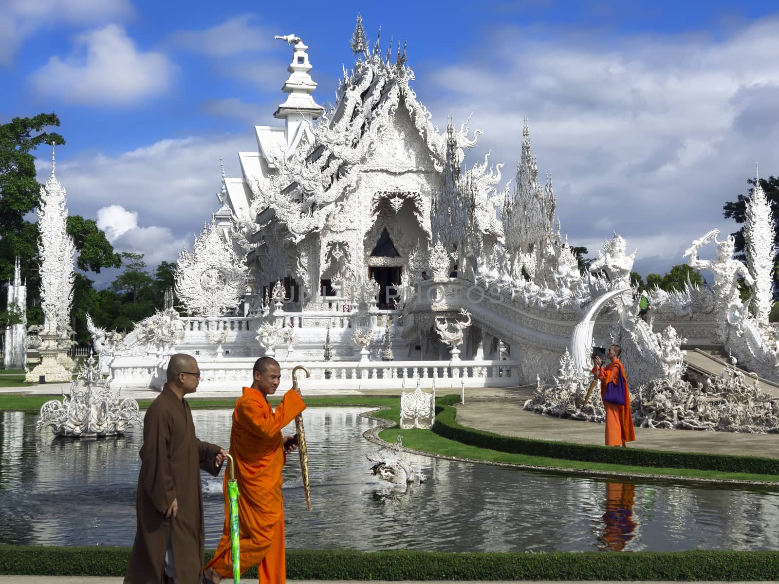 Buddhist Monks, Fountain and White Temple. by GNNick