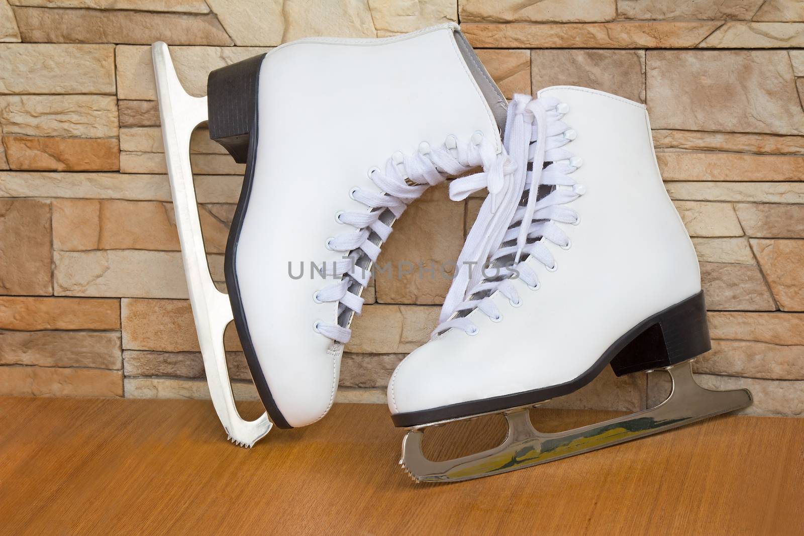 
The skates and graceful boots of white color for figure skating on ice for women.